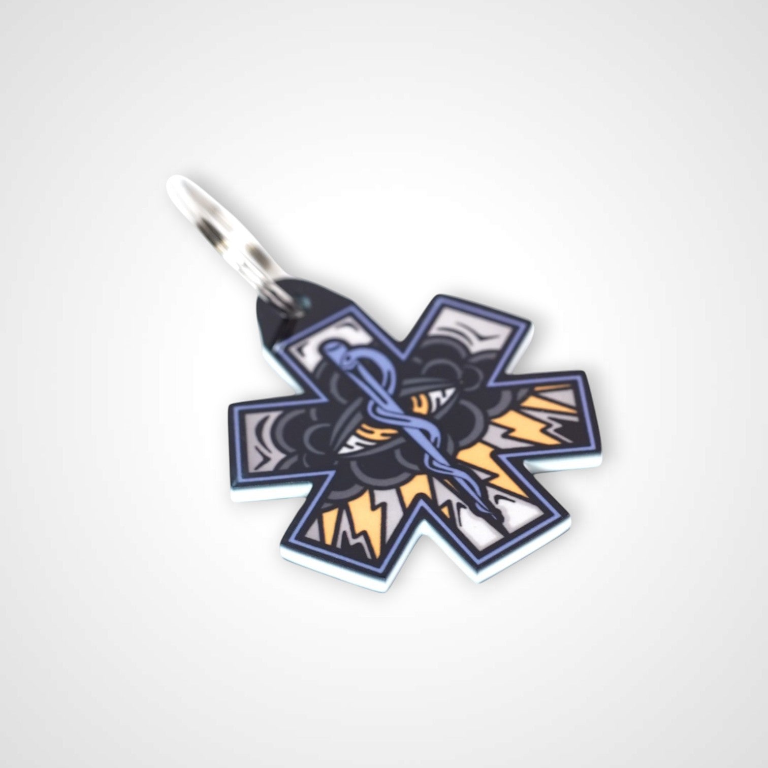 Black Cloud cast acrylic keychain with double coil keyring. Shown on white background.