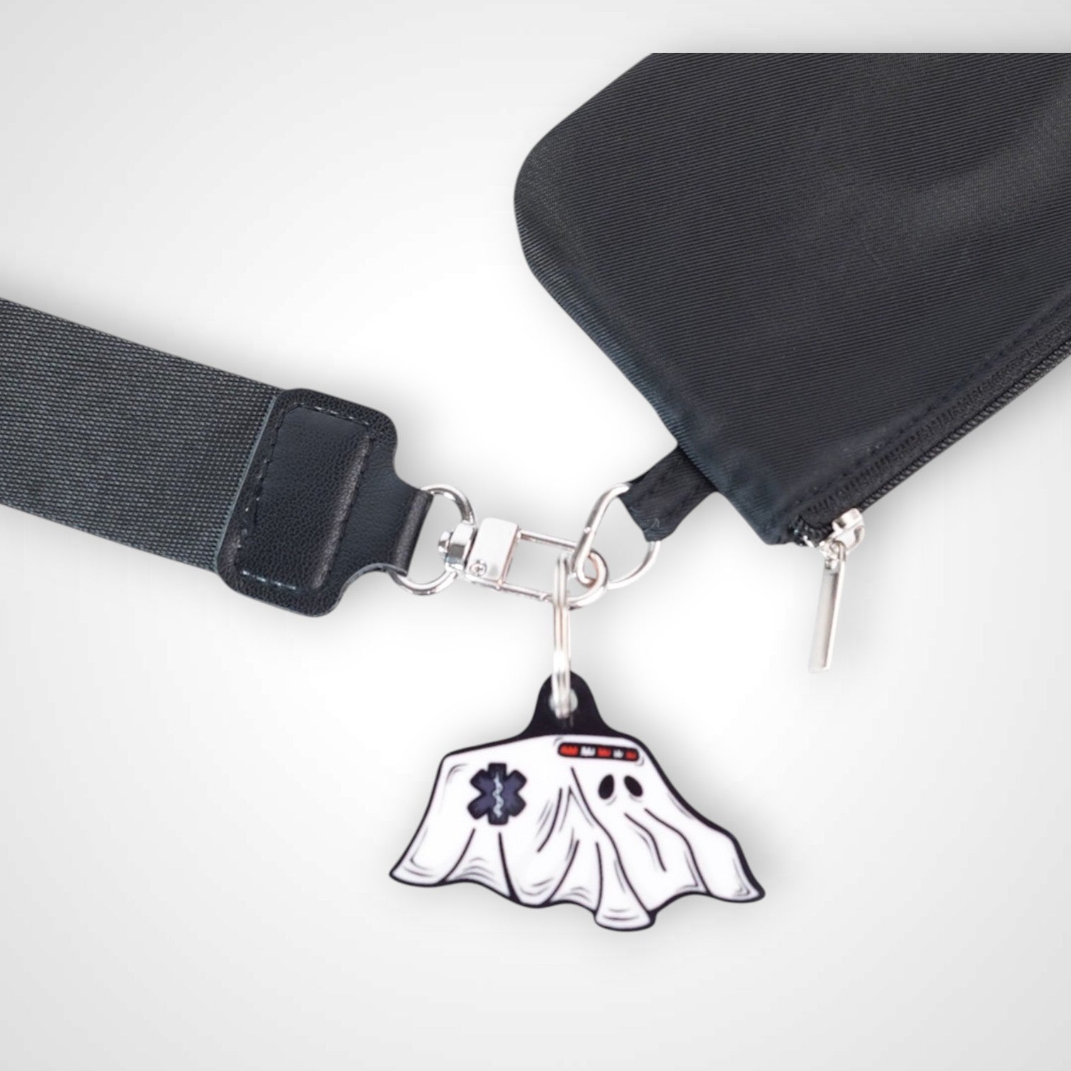 Boo boo bus cast acrylic keychain with double coil keyring. Shown on wallet.