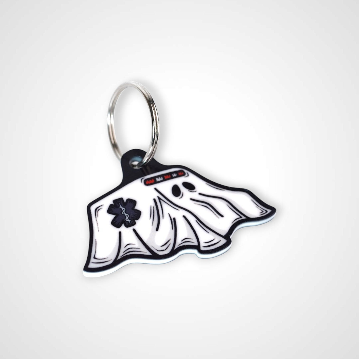 Boo boo bus cast acrylic keychain with double coil keyring. Shown on white background.