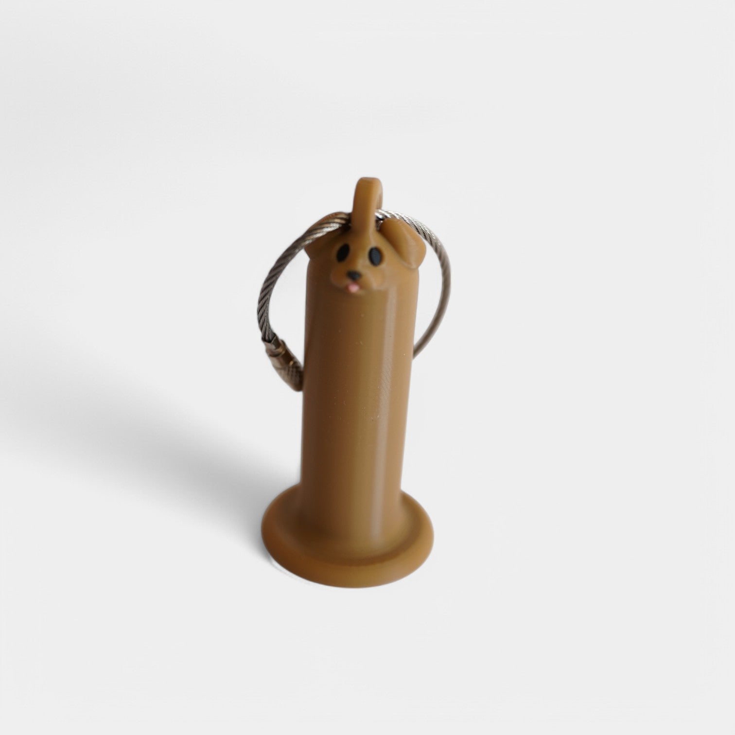 a compact brown dog roll holder 2 inches tall to hold and tape and coban for EMS, paramedics, EMT's, nurses, flightmed, vetmed, and athletic trainers