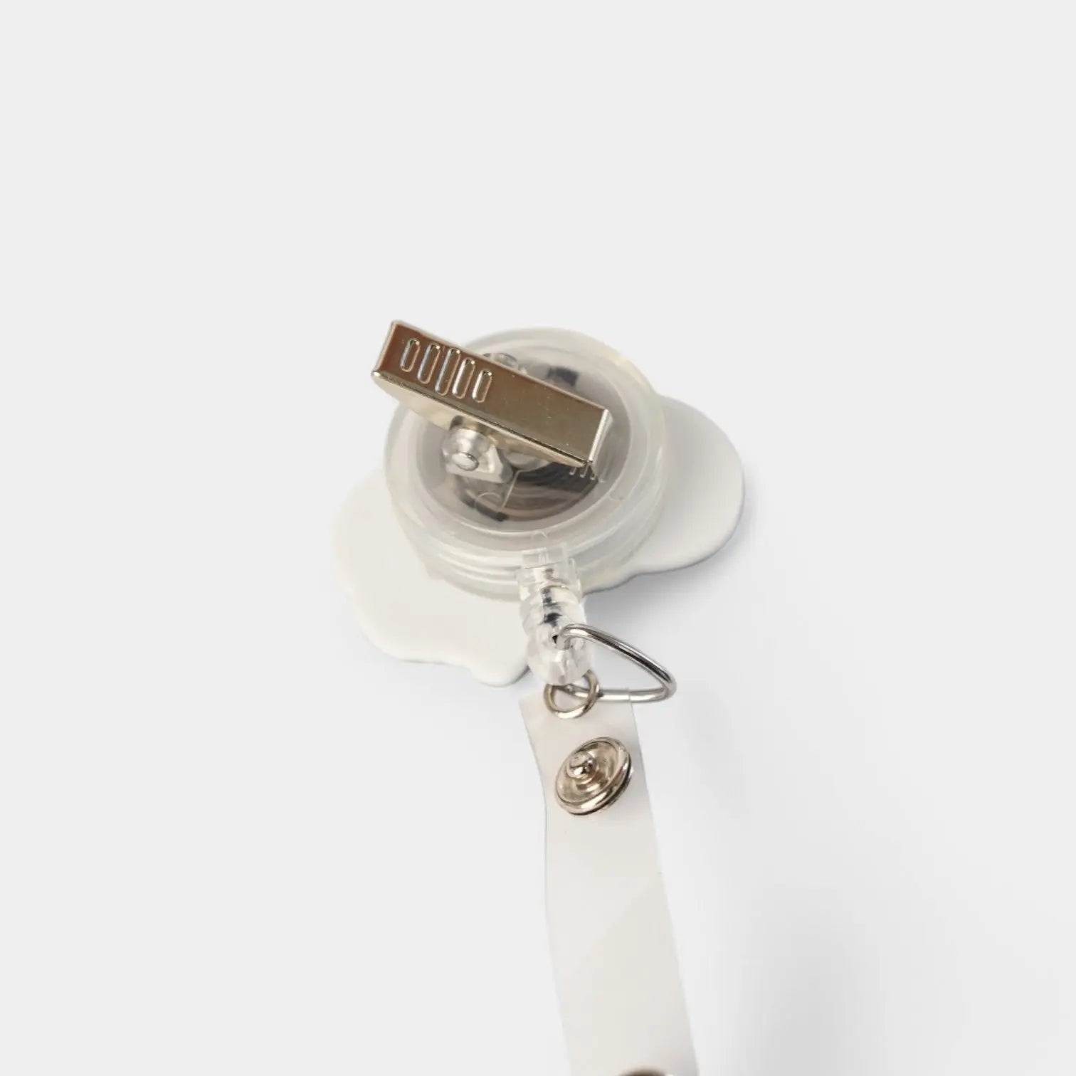 Sagittal Brain badge reel. On a swivel-alligator clip that rotates 360° with a nylon retractable string. Shown on a white background.