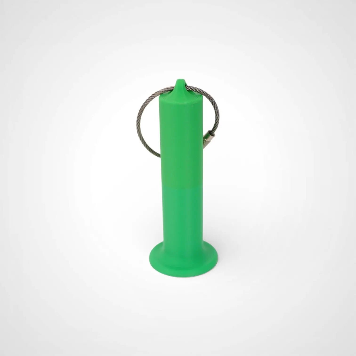 Green 3-inch roll holder made with polylactic acid, created using additive manufacturing for holding tape and bandage rolls. With a steel cable keyring. Shown on white background.
