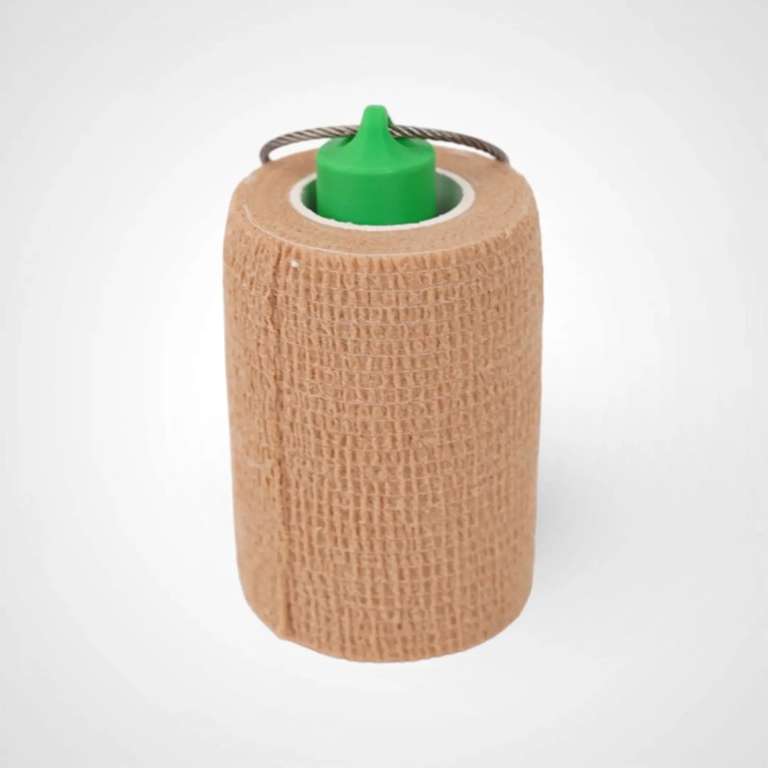 Green 3-inch roll holder made with polylactic acid, created using additive manufacturing for holding tape and bandage rolls. With a steel cable keyring. Shown with tape on white background.
