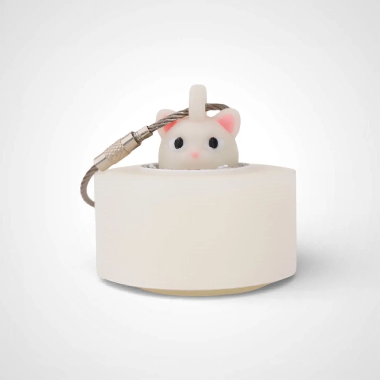 Cat White Glow 1-inch roll holder made with polylactic acid, created using additive manufacturing for holding tape and bandage rolls. With a steel cable keyring. Shown with tape on white background.