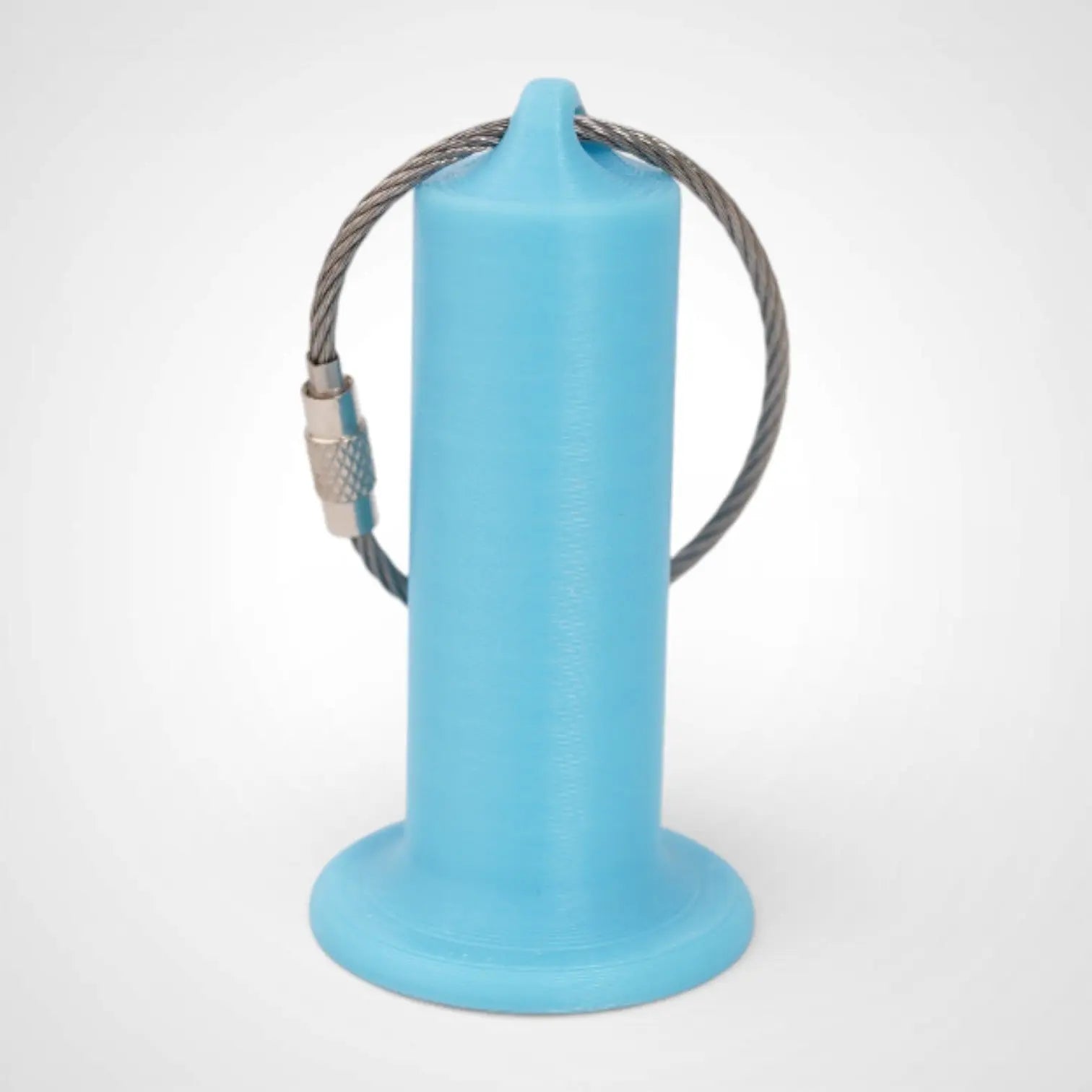 Blue Glow Teal 2-inch roll holder made with polylactic acid, created using additive manufacturing for holding tape and bandage rolls. With a steel cable keyring. Shown on white background.