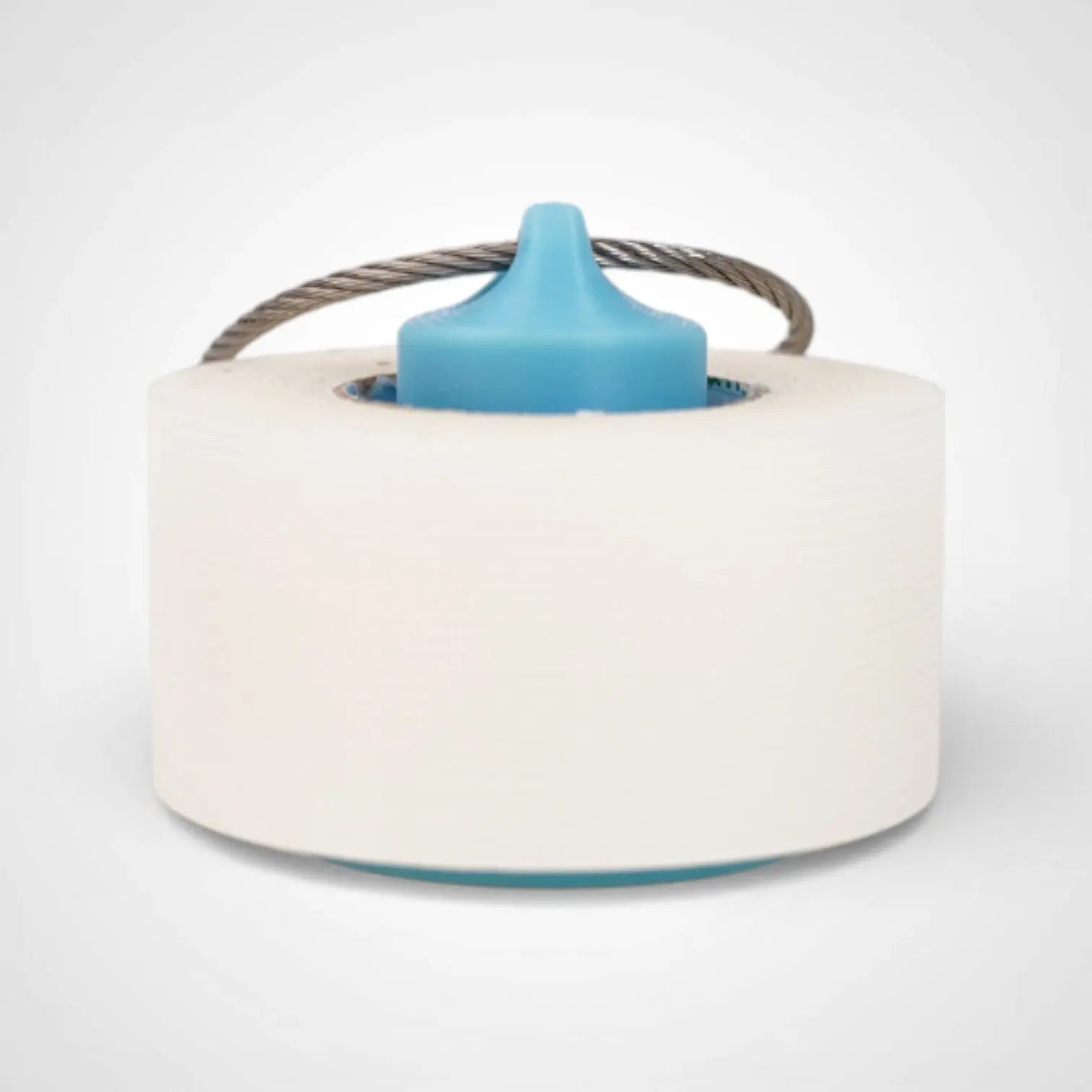 Blue Glow Teal 1-inch roll holder made with polylactic acid, created using additive manufacturing for holding tape and bandage rolls. With a steel cable keyring. Shown with tape on white background.
