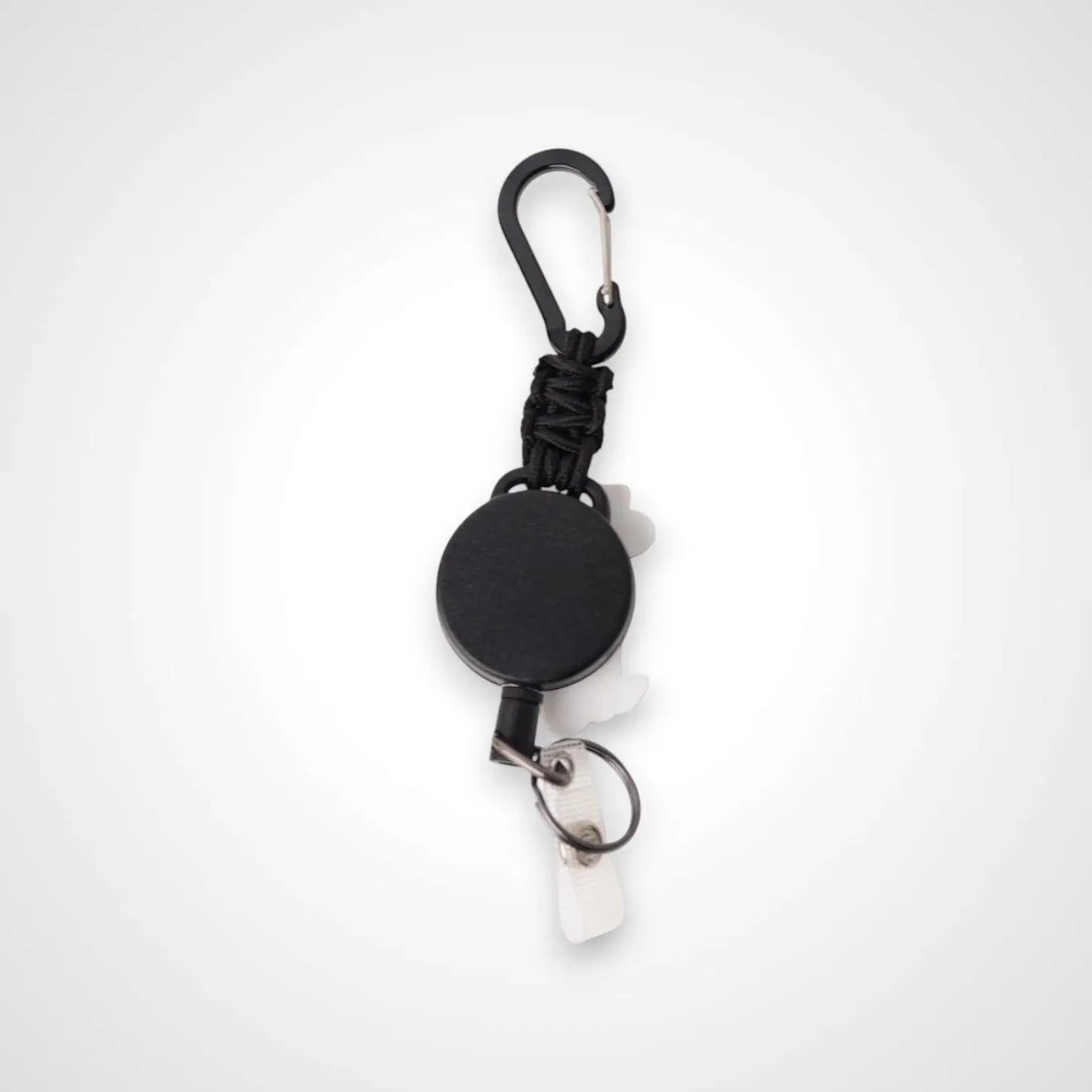 Cowboy Cat badge reel. On a carabiner with a steel retractable cable. Shown on a white background.
