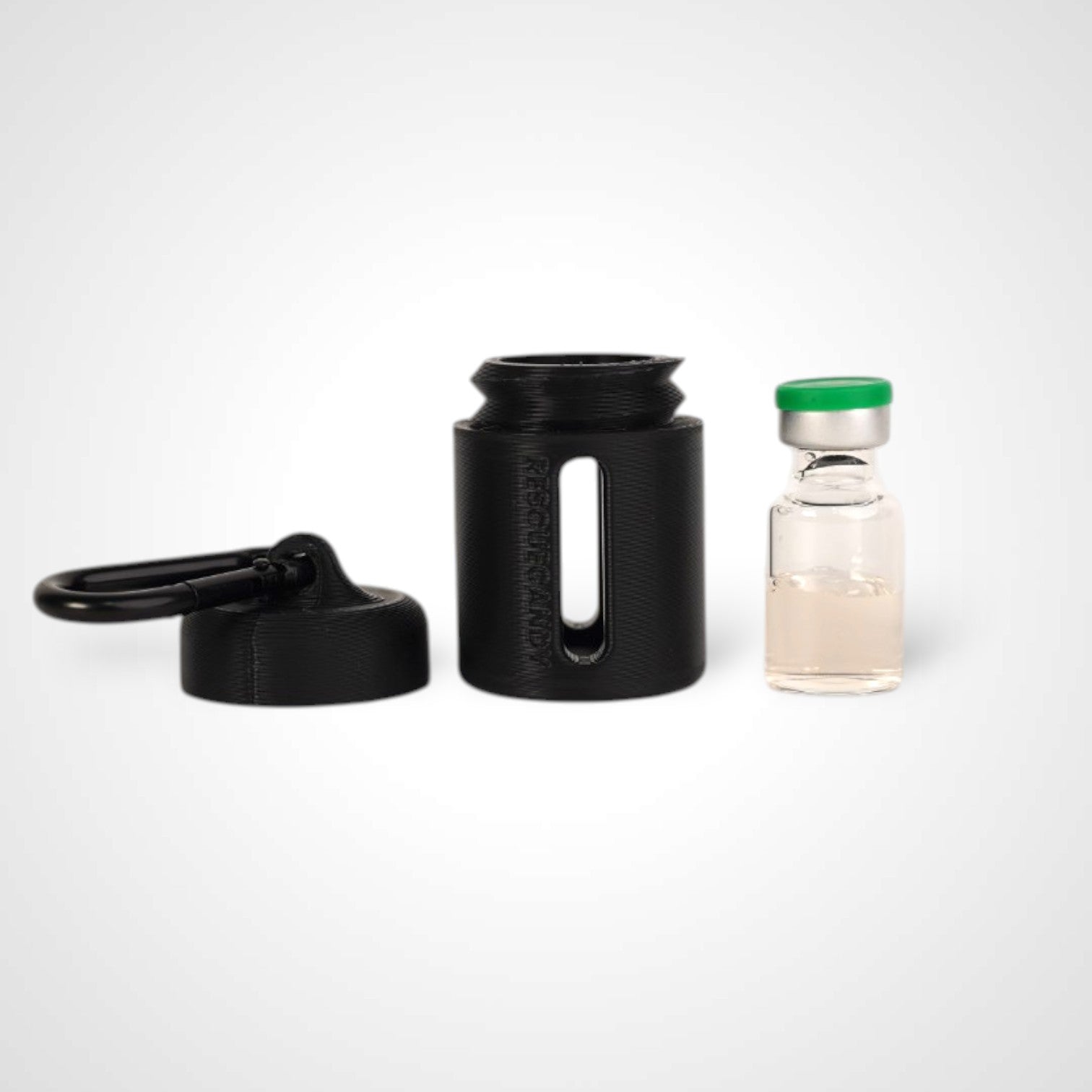 Black vial vault. For empty 2ml or smaller vials, made with polylactic acid created using additive manufacturing. With 1.37" stainless steel black coated carabiner. Shown next to vial on white background.