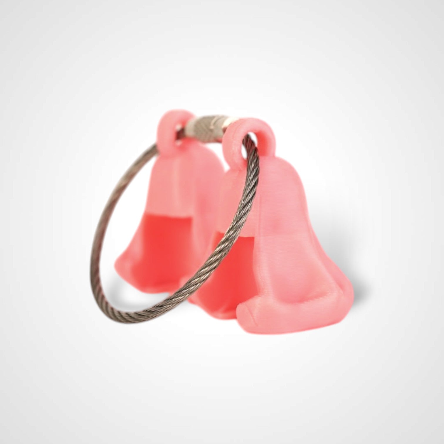 Two pink polylactic acid created using additive manufacturing ghost cap clips on steel cable keyring. Shown on a white background.
