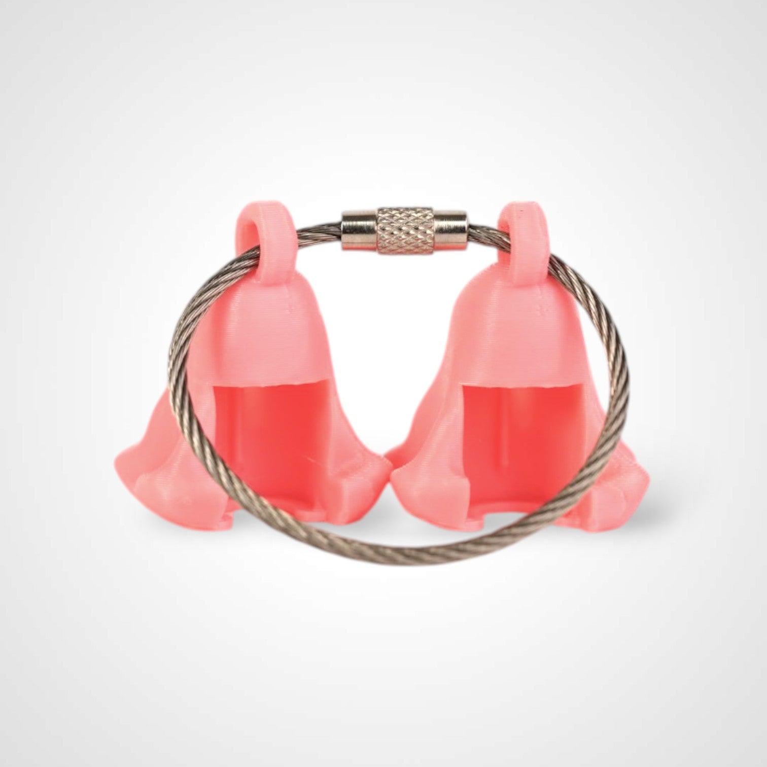 Two pink polylactic acid created using additive manufacturing ghost cap clips on steel cable keyring. Shown on a white background.