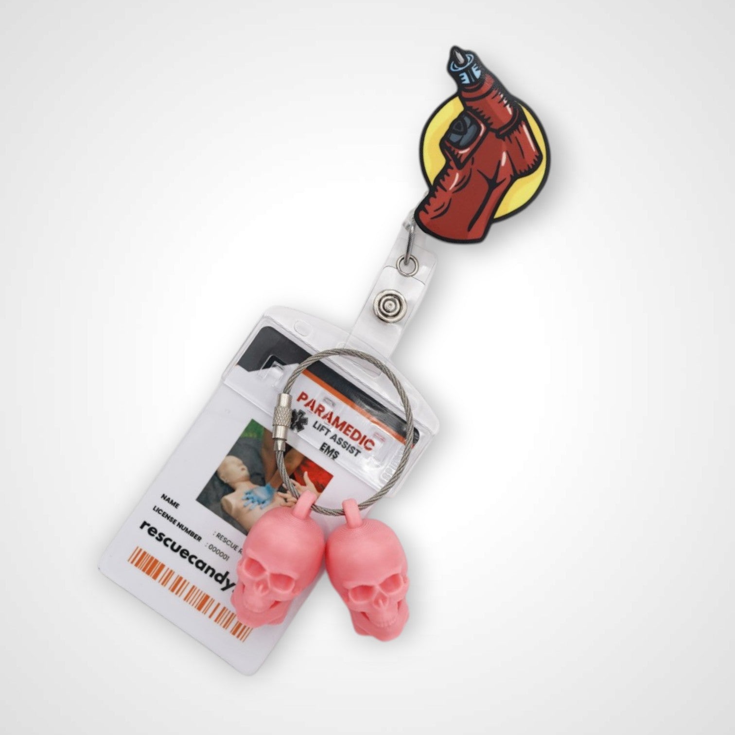 IO Drill badge reel. On a swivel-alligator clip that rotates 360° with a nylon retractable string. Shown on a white background.