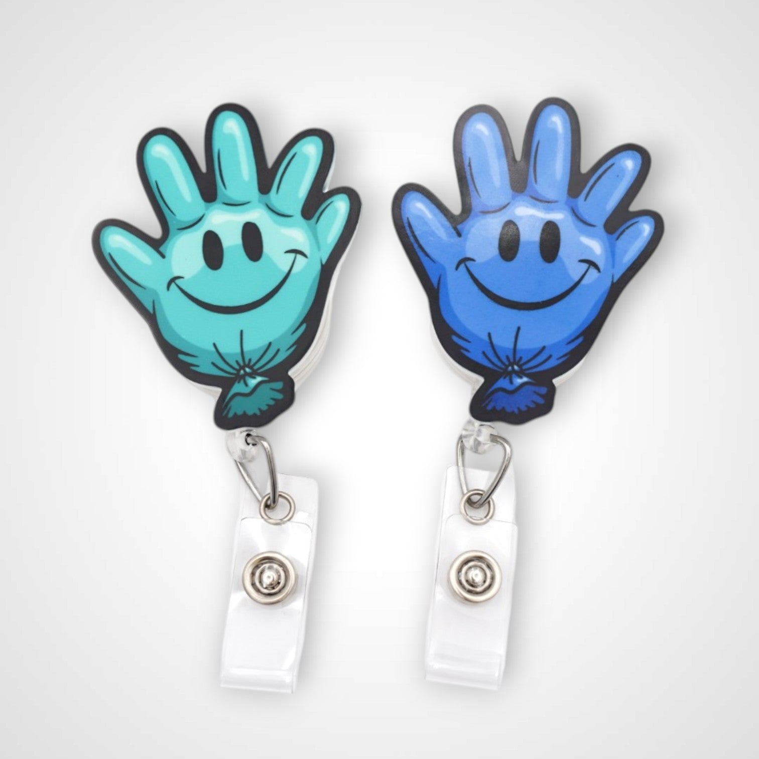 Teal and blue happy glove partner set badge reel. On a swivel-alligator clip that rotates 360° with a nylon retractable string. Shown on a white background.