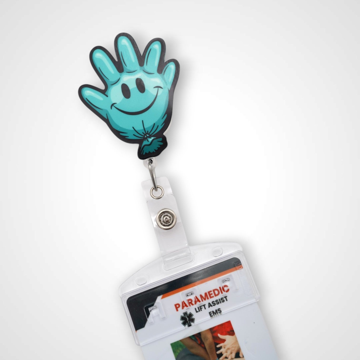Teal Happy Glove badge reel. On a swivel-alligator clip that rotates 360° with a nylon retractable string. Shown on a white background.