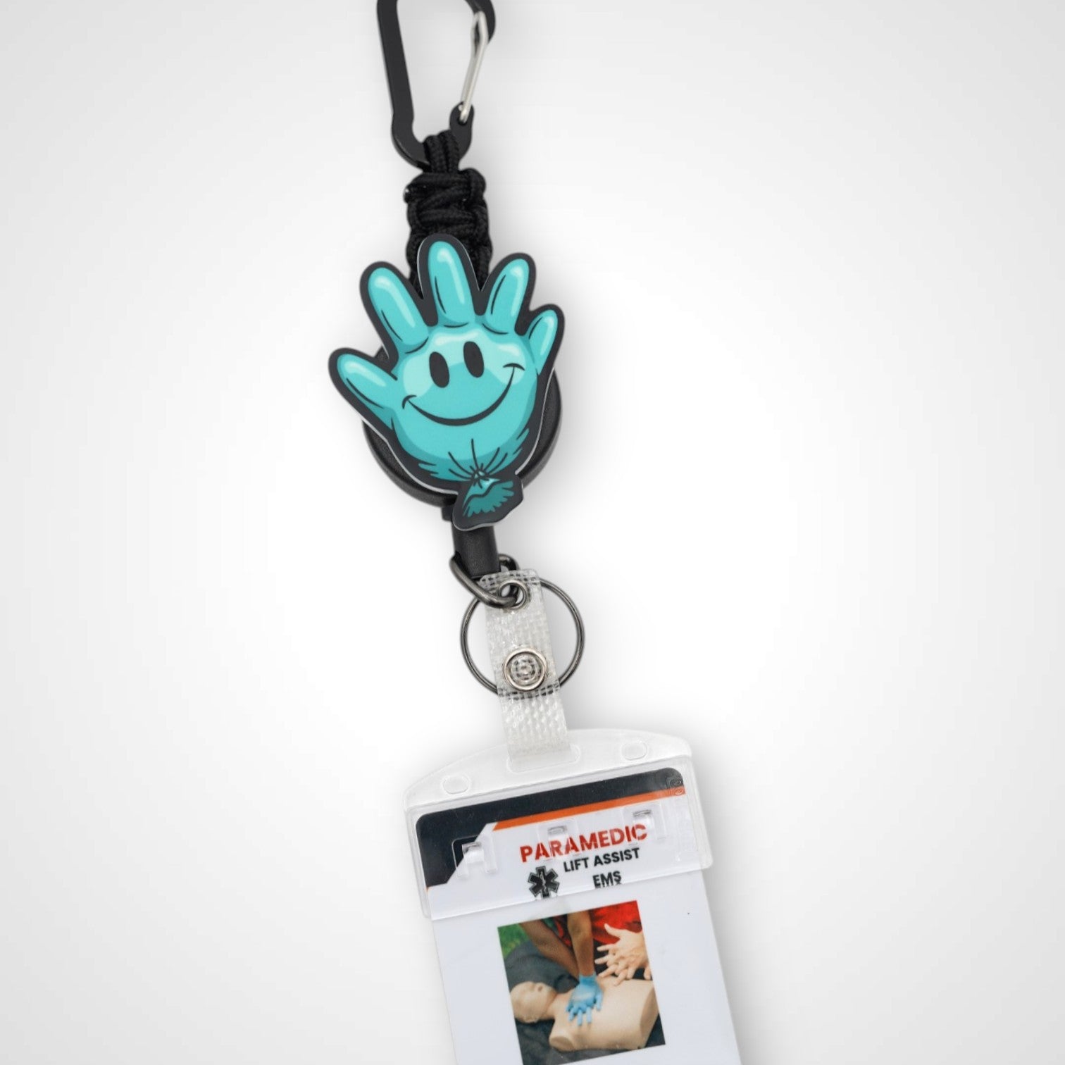 Teal Happy Glove badge reel. On a carabiner with a steel retractable cable. Shown on a white background.