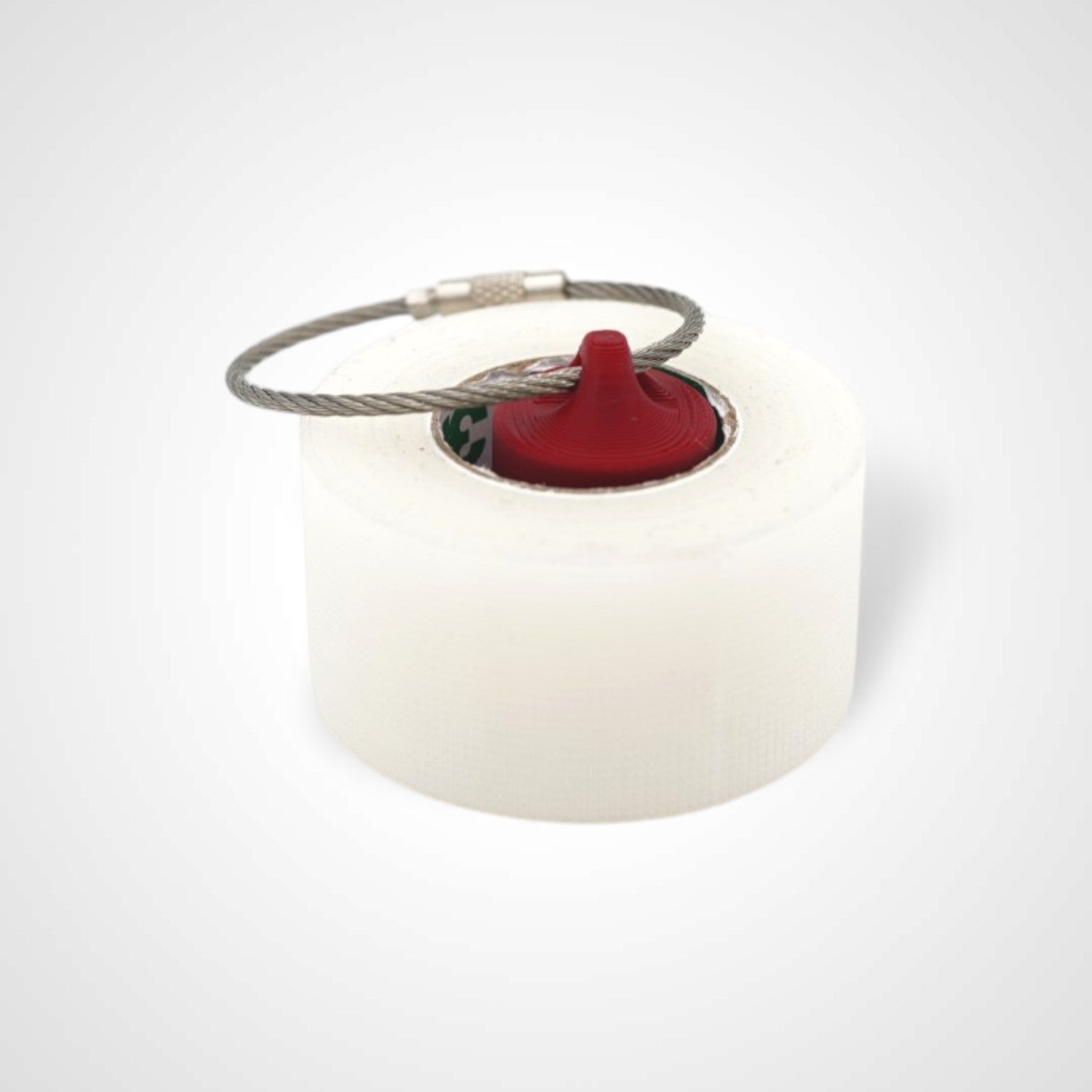 Red 1-inch roll holder made with polylactic acid, created using additive manufacturing for holding tape and bandage rolls. With a steel cable keyring. Shown with tape on white background.