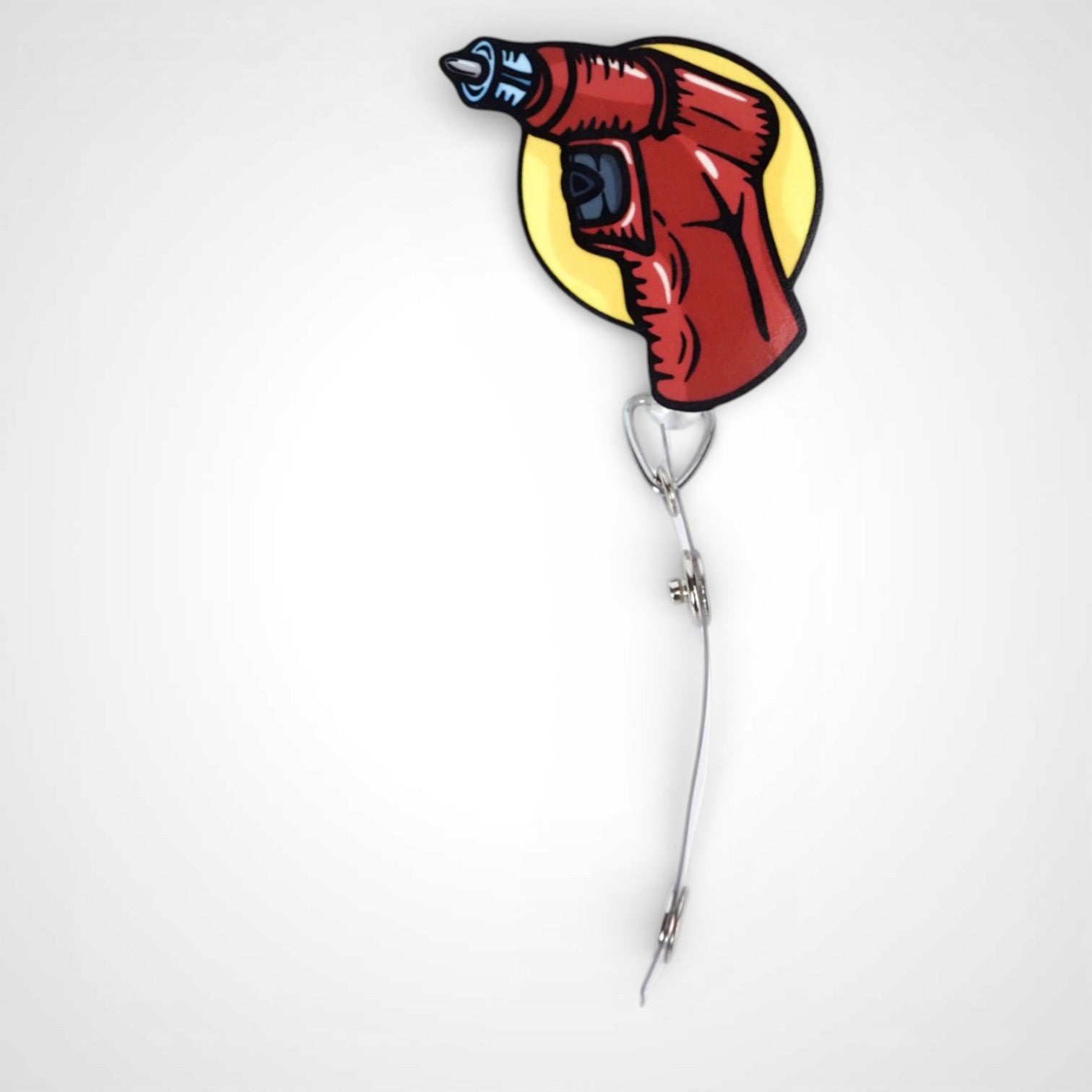 IO Drill badge reel. On a swivel-alligator clip that rotates 360° with a nylon retractable string. Shown on a white background.