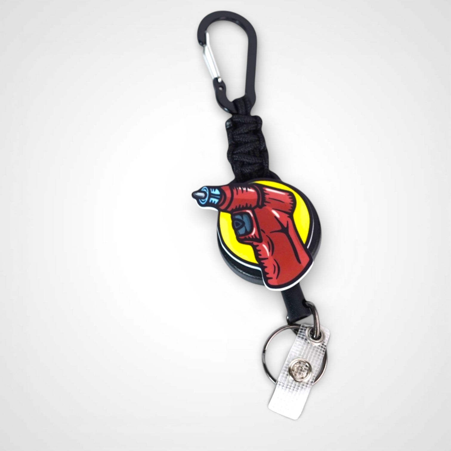 IO Drill badge reel. On a carabiner with a steel retractable cable. Shown on a white background.