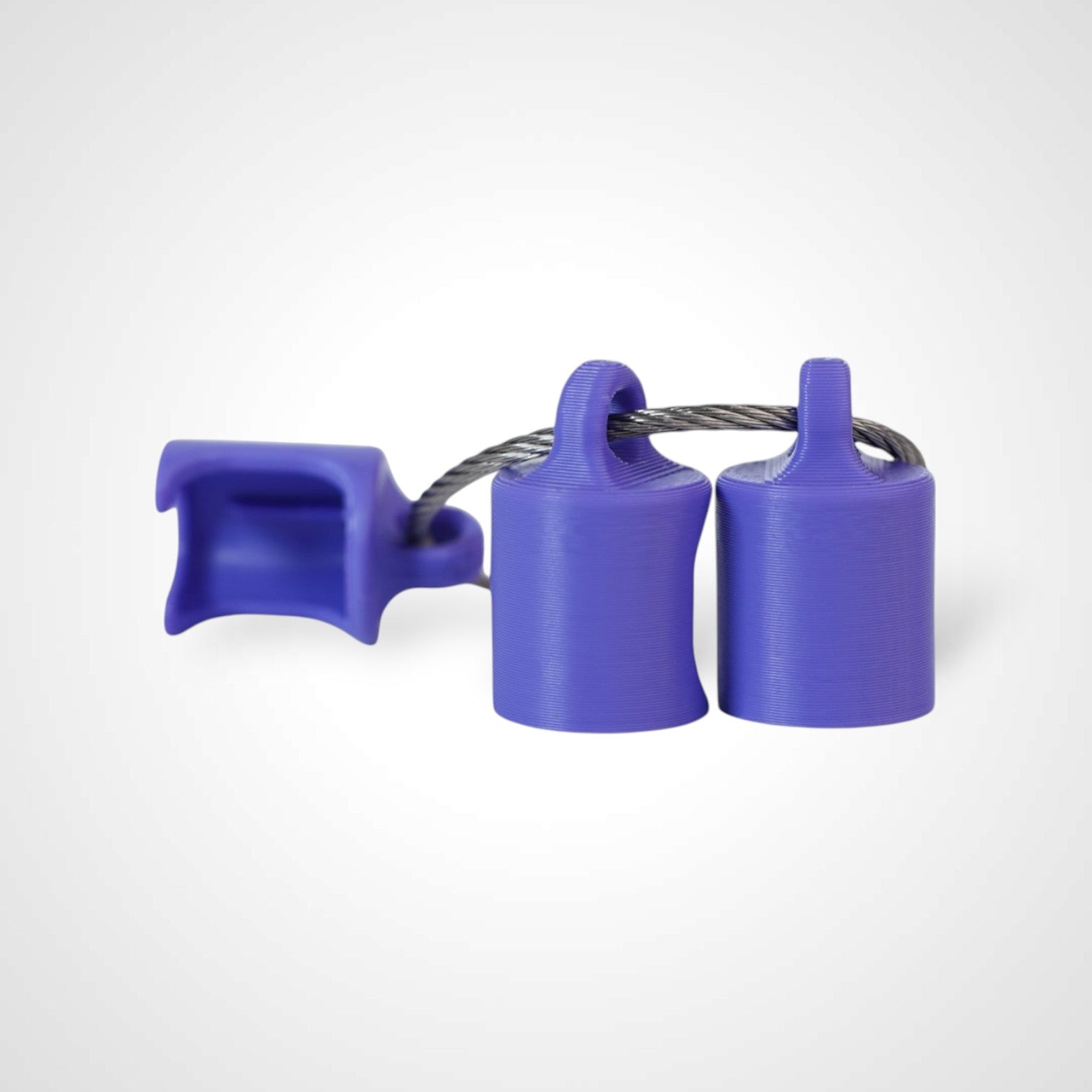 Three purple polylactic acid created using additive manufacturing classic cap clips on steel cable keyring. Shown on a white background.