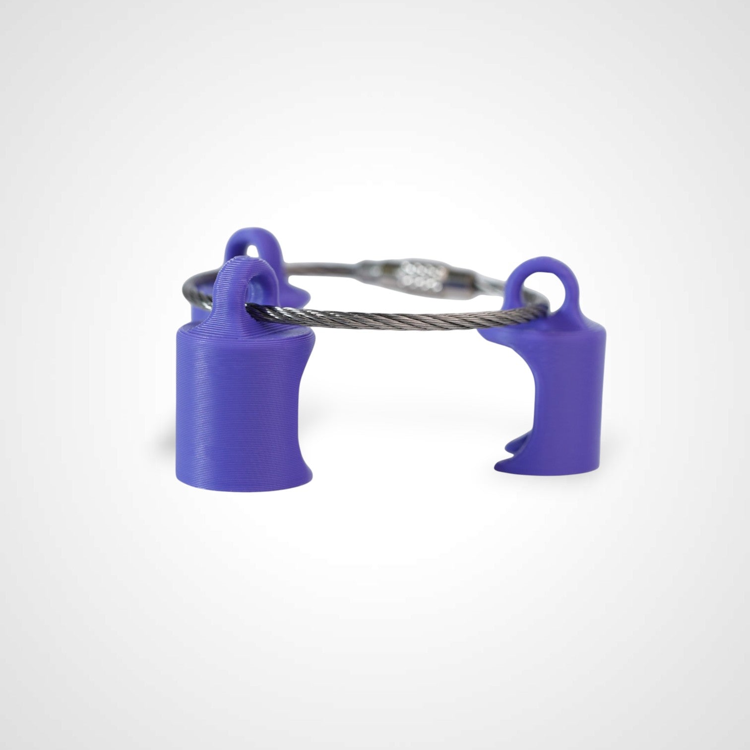Three purple polylactic acid created using additive manufacturing classic cap clips on steel cable keyring. Shown on a white background.