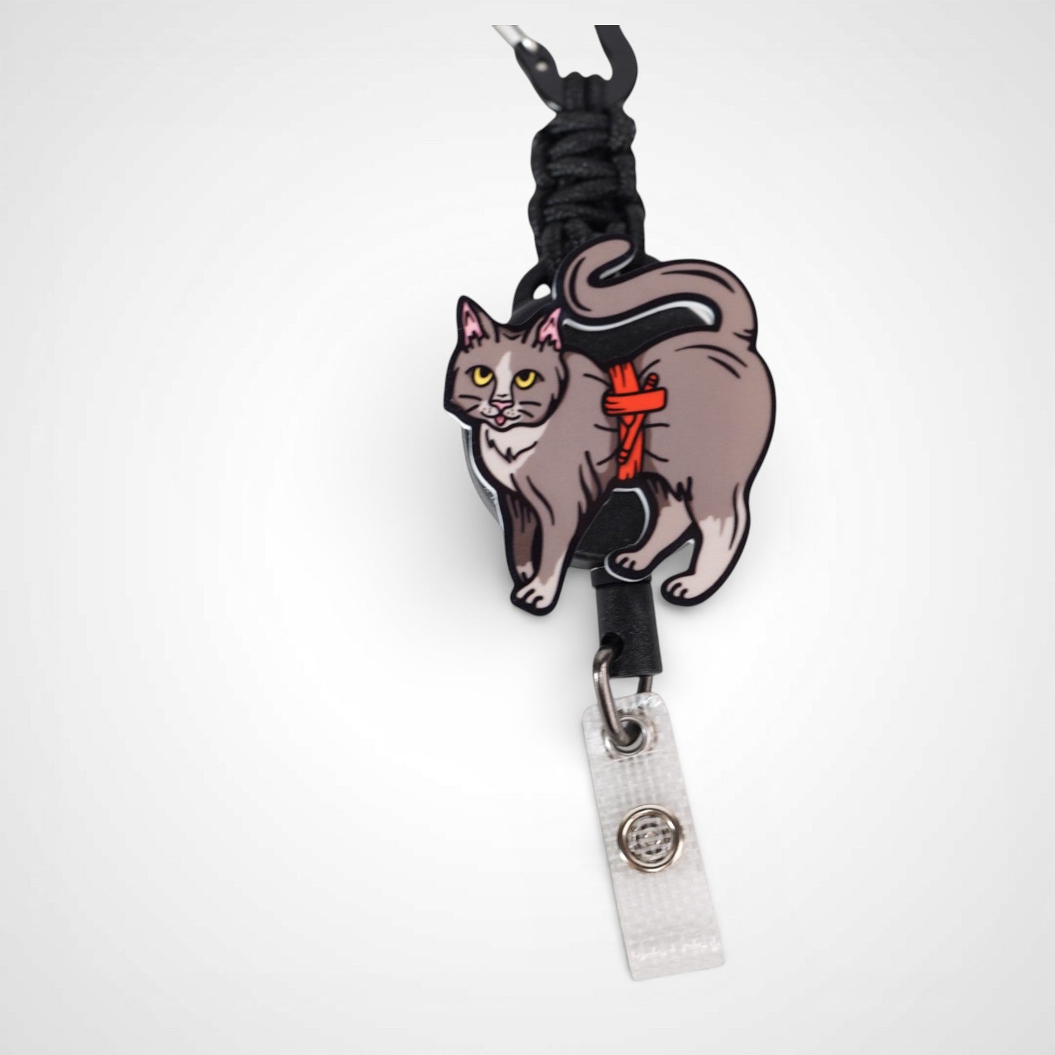 Tournicat badge reel. On a carabiner with a steel retractable cable. Shown on a white background.