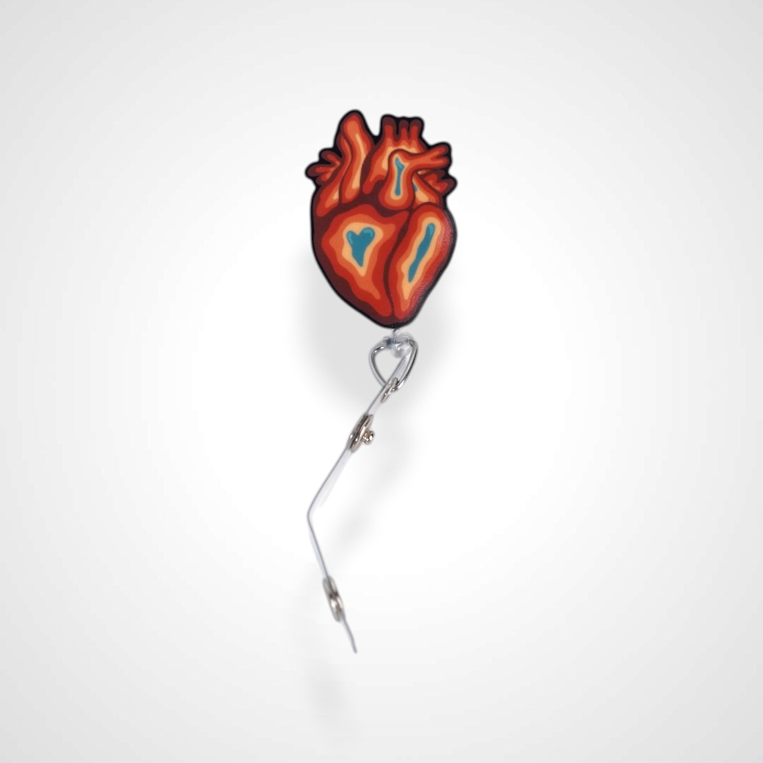 Trippy heart badge reel. On a swivel-alligator clip that rotates 360° with a nylon retractable string. Shown on a white background.