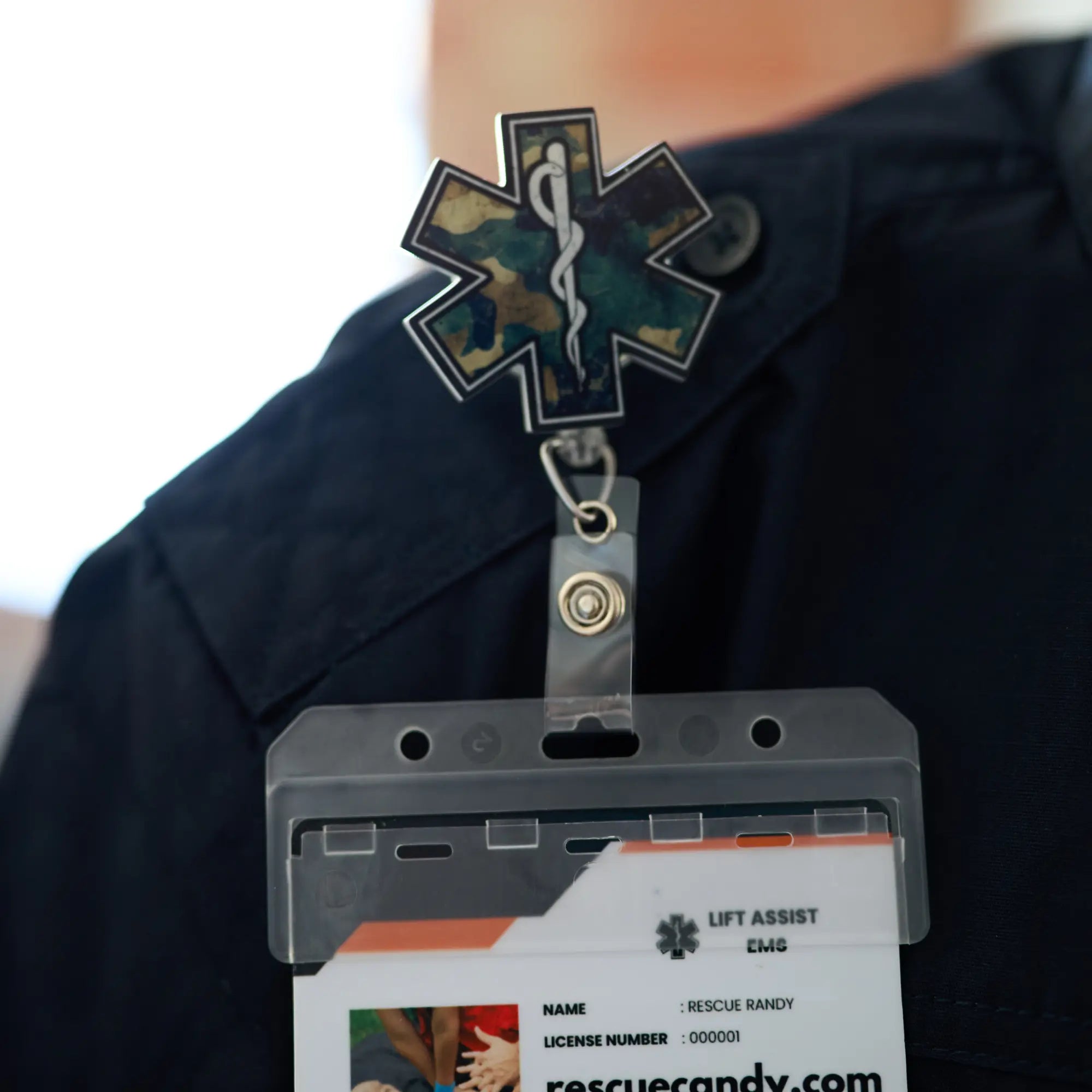Camo Star badge reel. On a swivel-alligator clip that rotates 360° with a nylon retractable string. Shown on attached to a shirt.