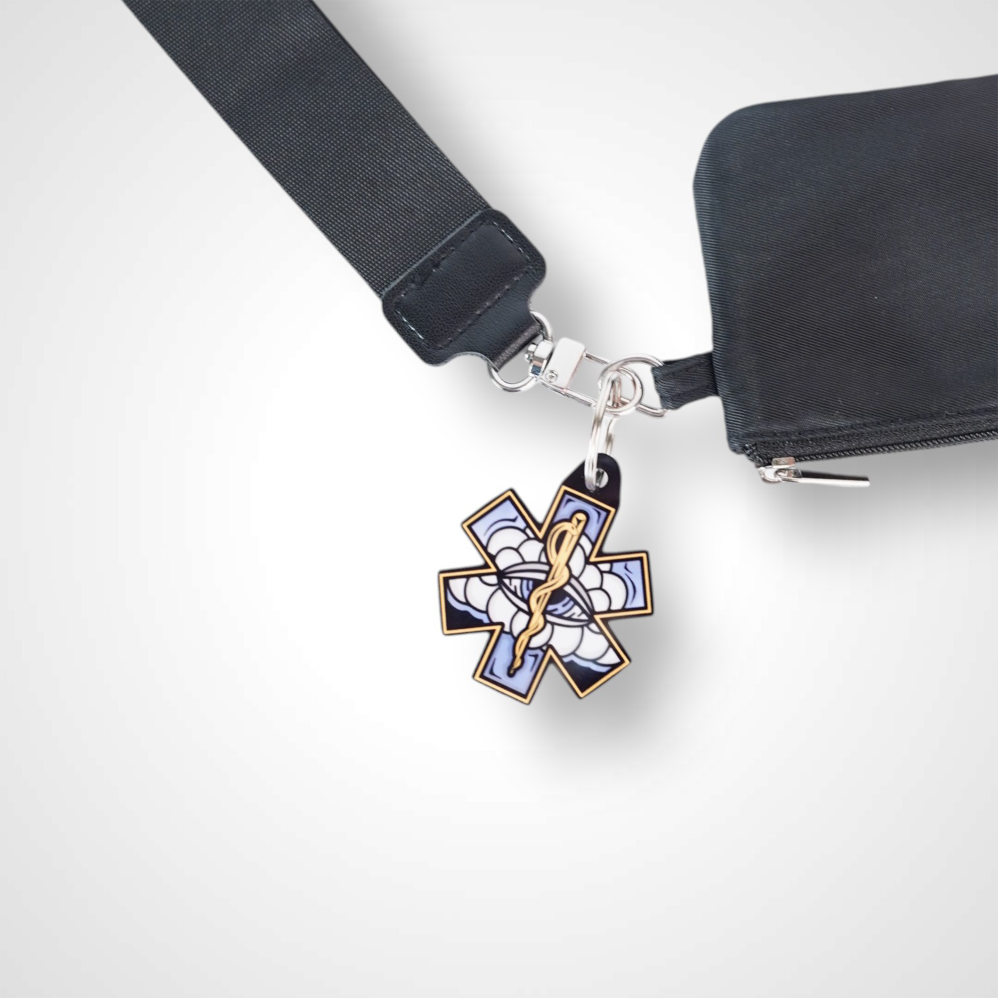 White Cloud cast acrylic keychain with double coil keyring. Shown on wallet.