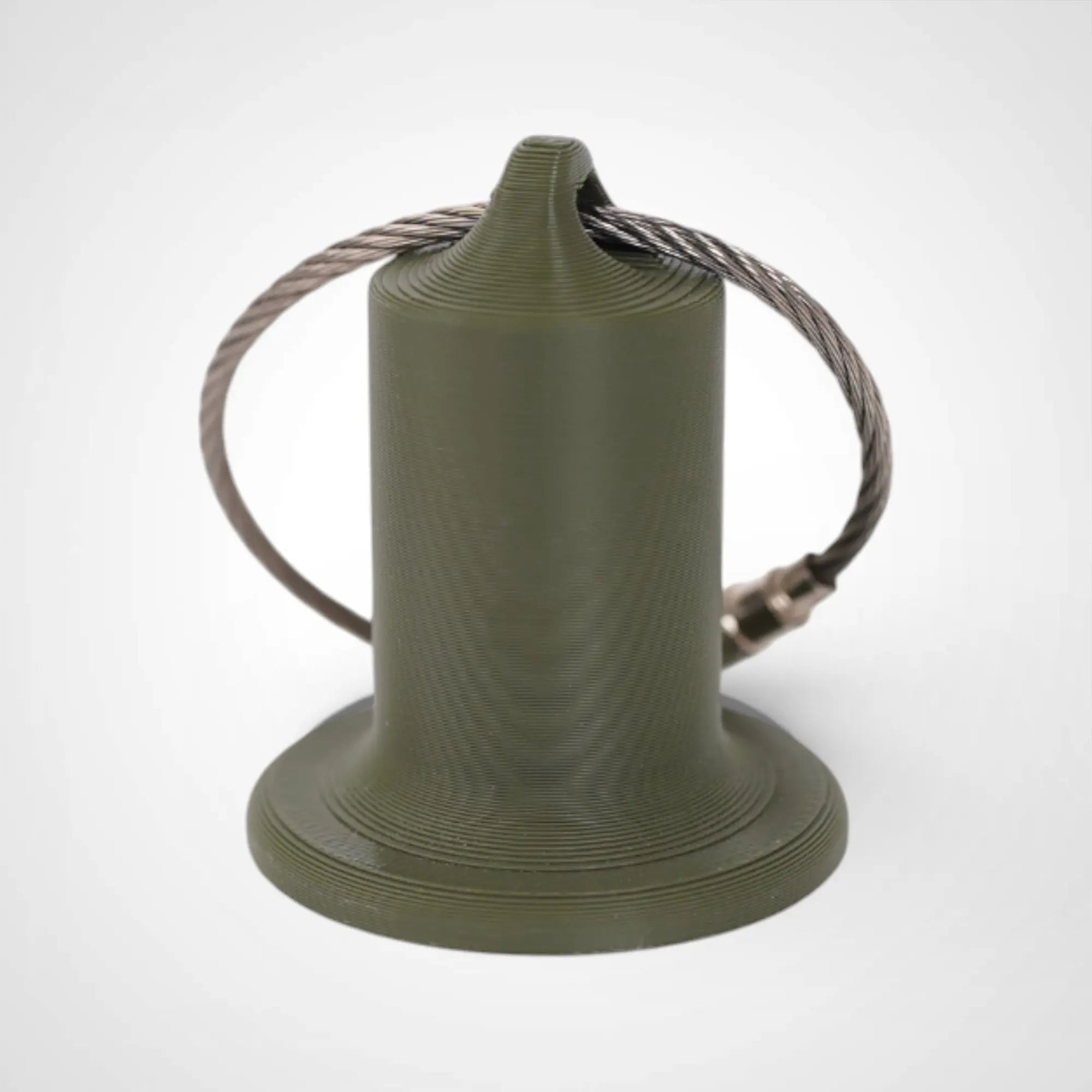 Army Green 1-inch roll holder made with polylactic acid, created using additive manufacturing for holding tape and bandage rolls. With a steel cable keyring. Shown on white background.