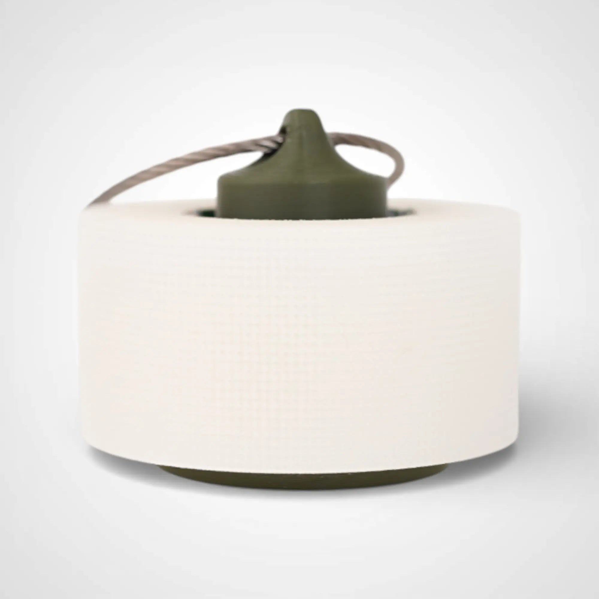 Army Green 1-inch roll holder made with polylactic acid, created using additive manufacturing for holding tape and bandage rolls. With a steel cable keyring. Shown with tape on white background.