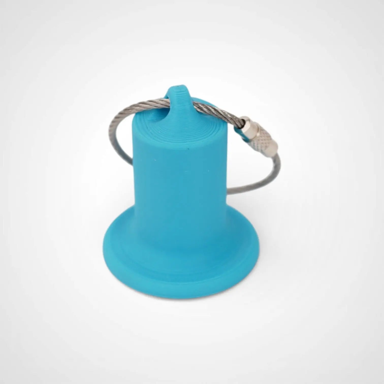 1-inch blue roll holder made with polylactic acid created using additive manufacturing for holding tape and bandage rolls. With a steel cable keyring. Shown on white background.
1-inch tall