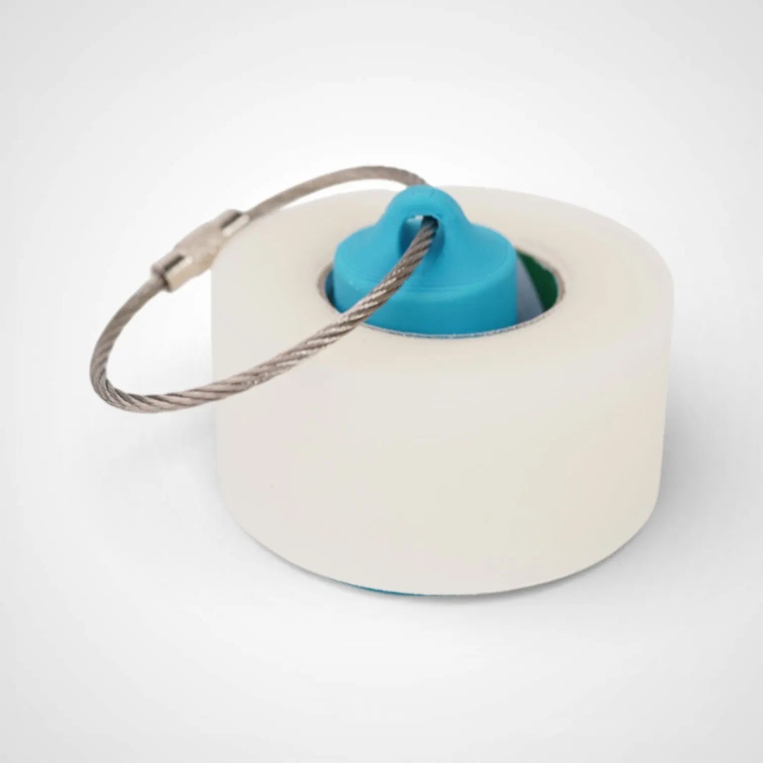 1-inch blue roll holder made with polylactic acid created using additive manufacturing for holding tape and bandage rolls. With a steel cable keyring. Shown with tape on white background.
1-inch tall