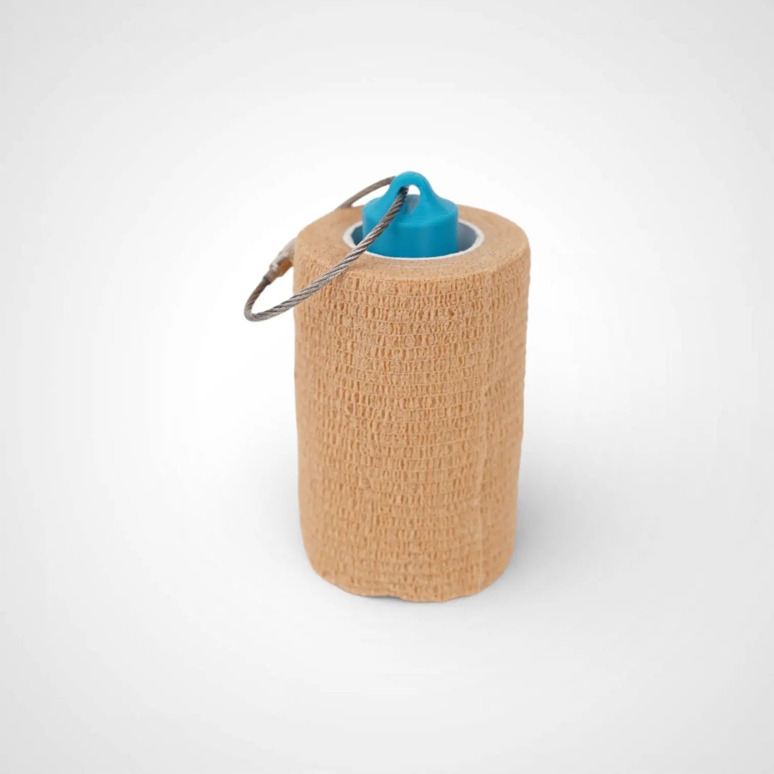 a compact utility keychain called a blue roll holder 3 inches tall to hold and tape transpore tape cohesive bandage coban and bangade rolls for EMS, paramedics, EMT's, nurses, flightmed, vetmed, and athletic trainers