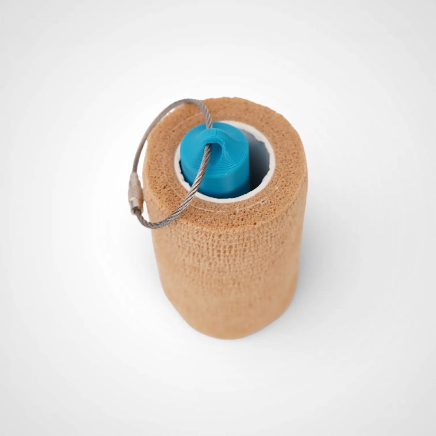 a compact utility keychain called a blue roll holder 3 inches tall to hold and tape transpore tape cohesive bandage coban and bangade rolls for EMS, paramedics, EMT's, nurses, flightmed, vetmed, and athletic trainers