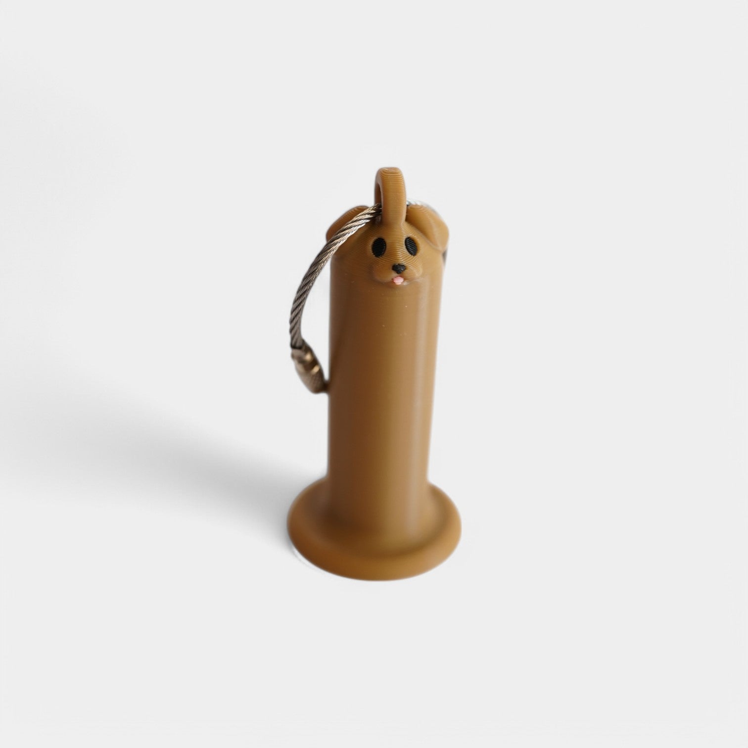 a compact brown dog roll holder 2 inches tall to hold and tape and coban for EMS, paramedics, EMT's, nurses, flightmed, vetmed, and athletic trainers
