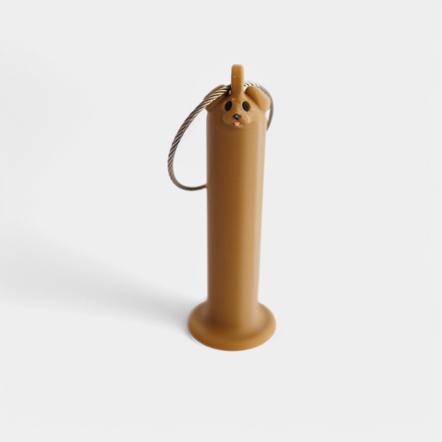 a compact brown dog roll holder 3 inches tall to hold and tape and coban for EMS, paramedics, EMT's, nurses, flightmed, vetmed, and athletic trainers