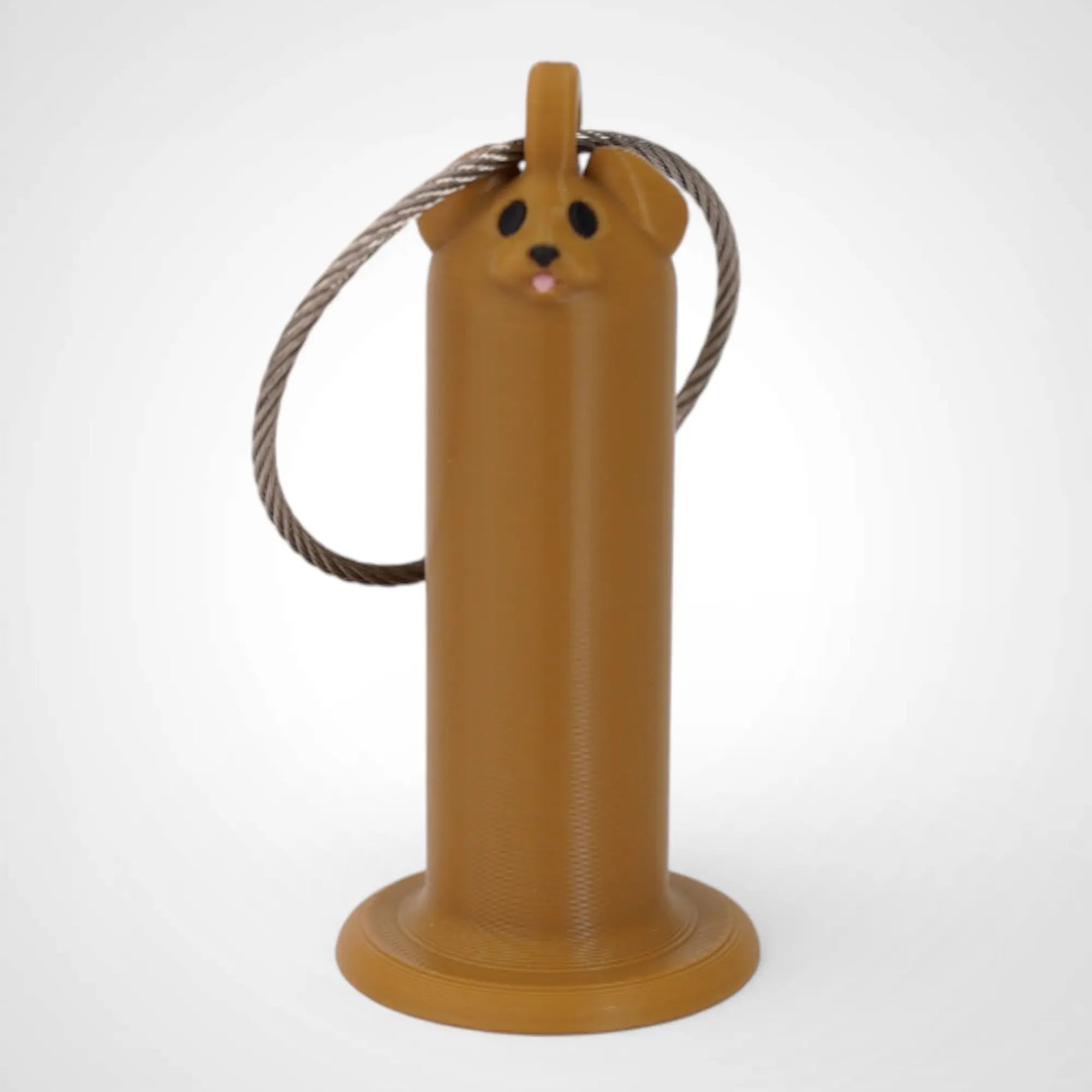 Brown Dog 2-inch roll holder made with polylactic acid, created using additive manufacturing for holding tape and bandage rolls. With a steel cable keyring. Shown on white background.