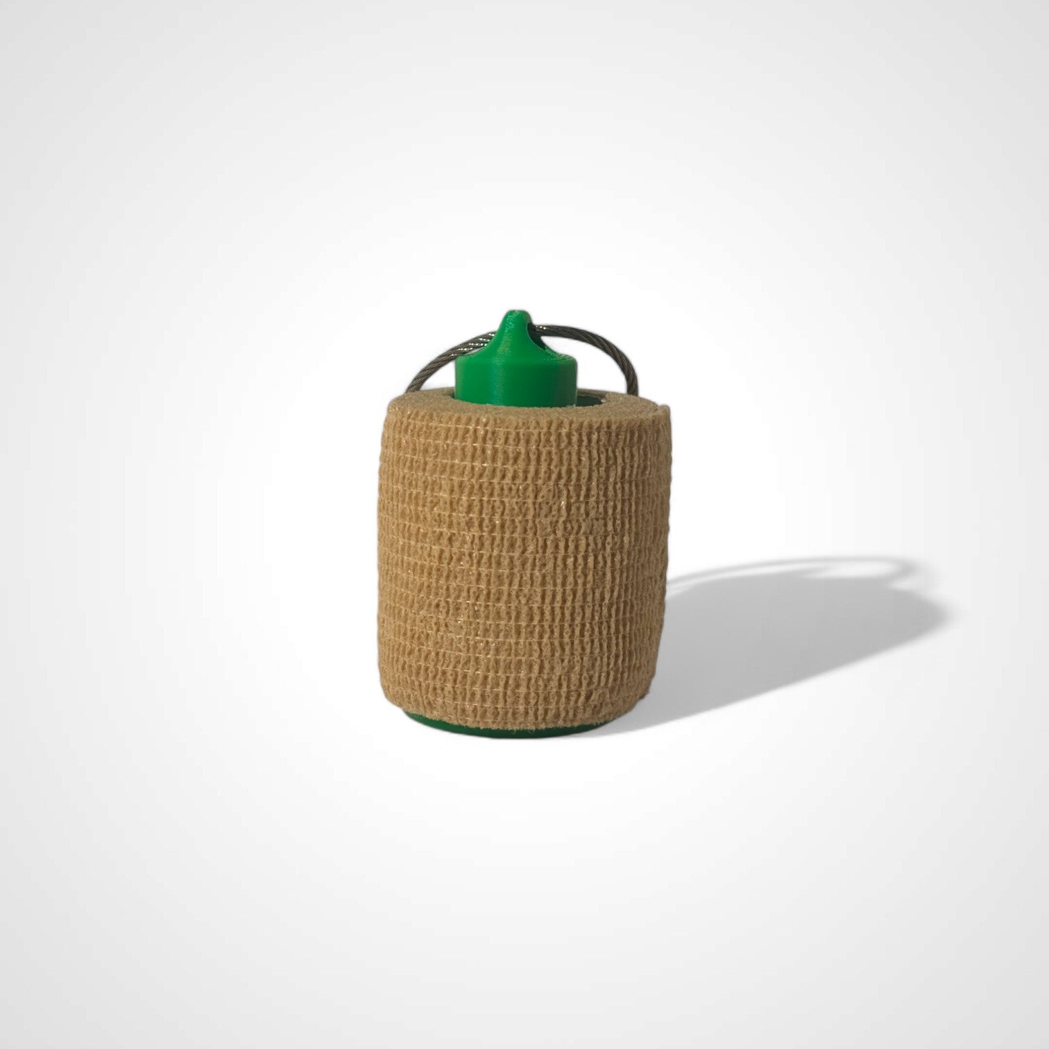 a compact green roll holder 2 inches tall to hold and tape and coban for EMS, paramedics, EMT's, nurses, flightmed, vetmed, and athletic trainers