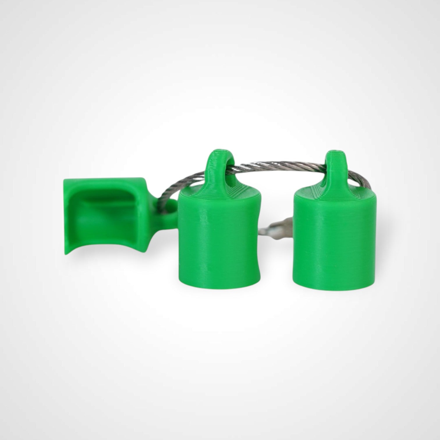 Three green polylactic acid created using additive manufacturing classic cap clips on steel cable keyring. Shown on a white background.