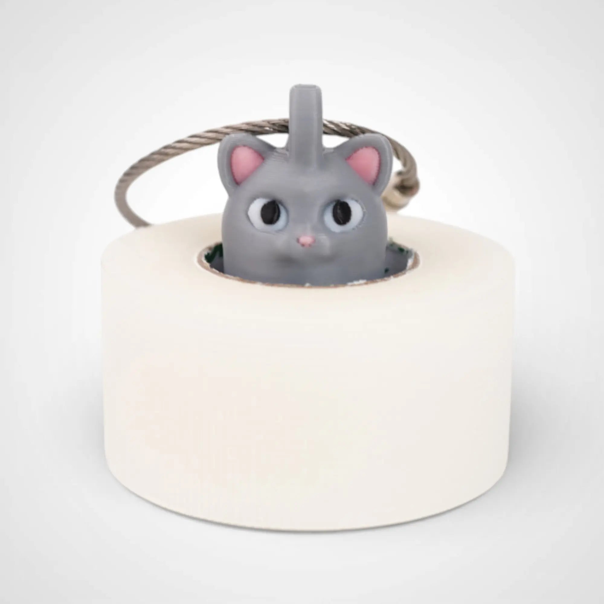 Cat Grey 1-inch roll holder made with polylactic acid, created using additive manufacturing for holding tape and bandage rolls. With a steel cable keyring. Shown with tape on white background.