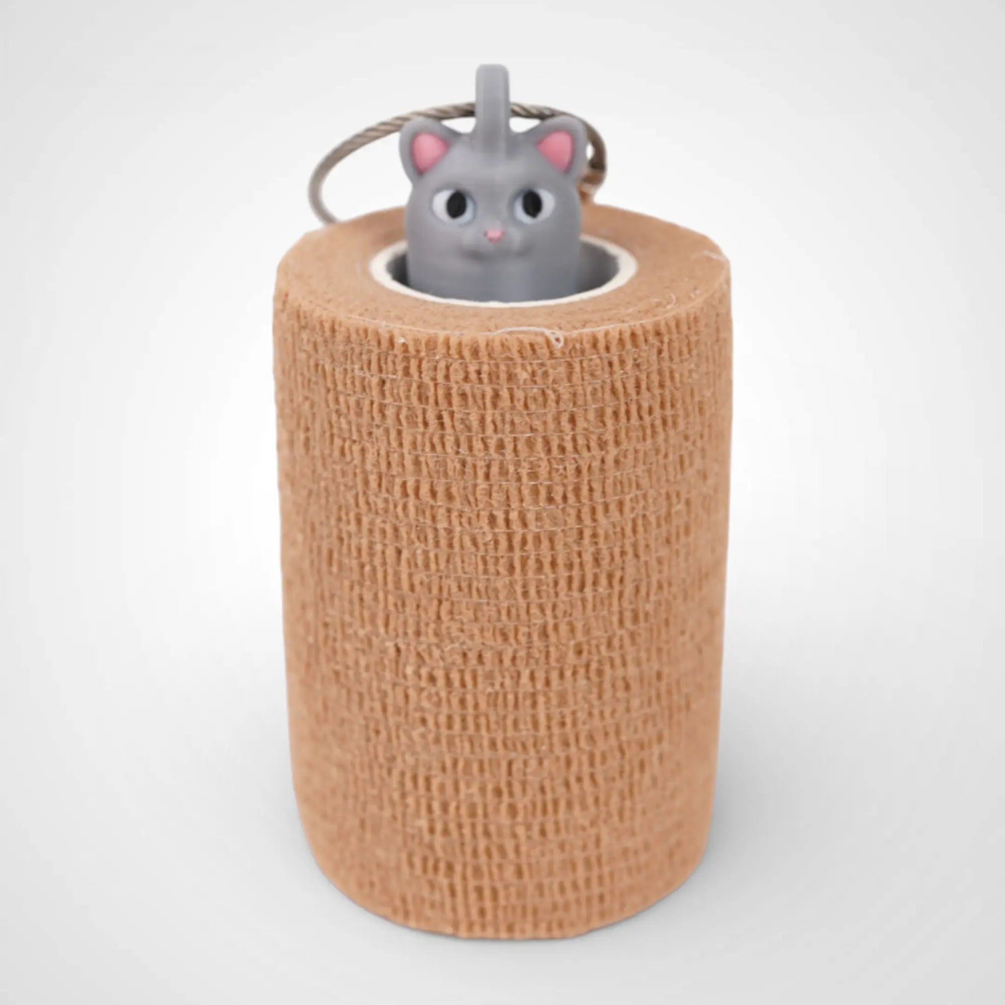 Cat Grey 3-inch roll holder made with polylactic acid, created using additive manufacturing for holding tape and bandage rolls. With a steel cable keyring. Shown with tape on white background.