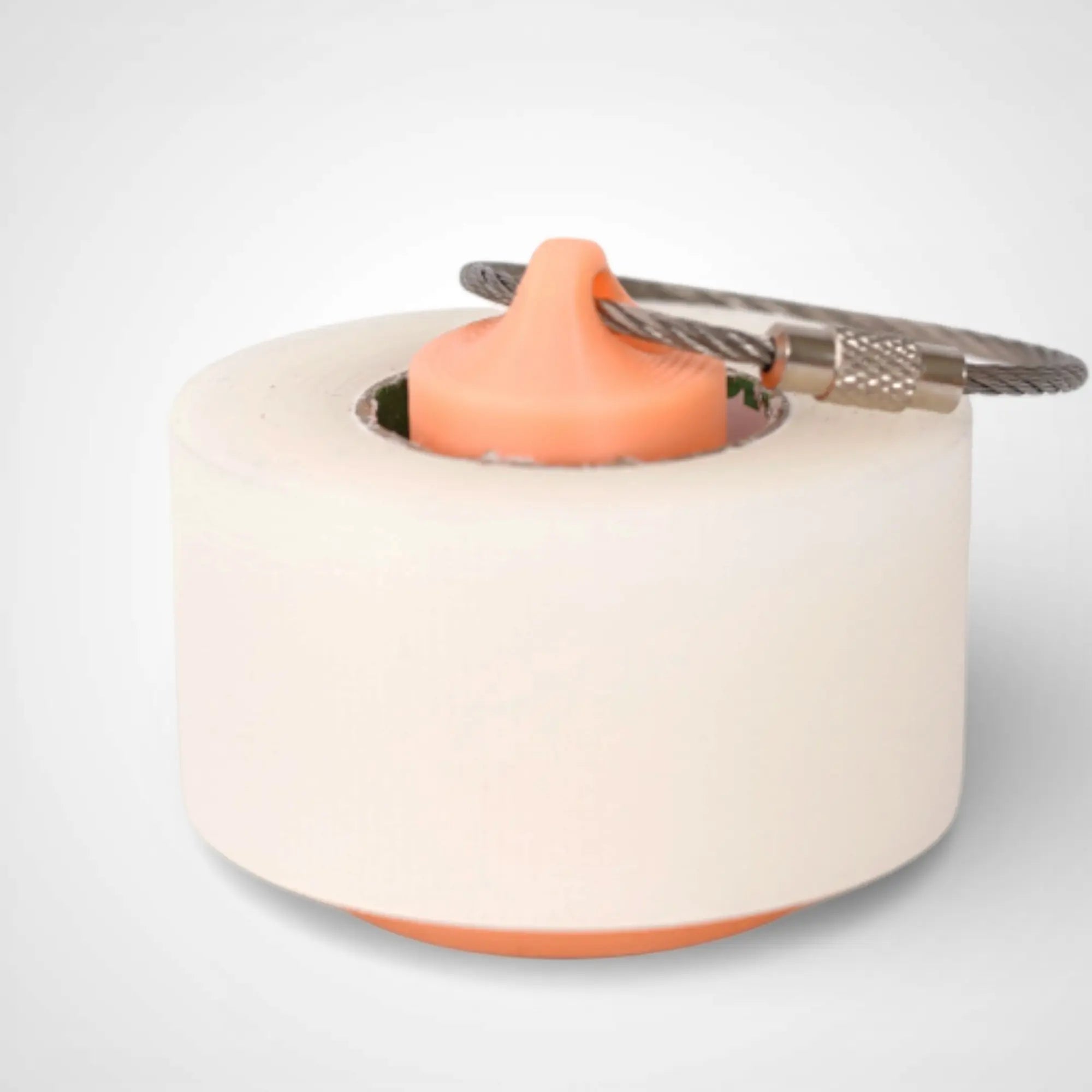Orange/Glow Yellow 1-inch roll holder made with polylactic acid, created using additive manufacturing for holding tape and bandage rolls. With a steel cable keyring. Shown with tape on white background.