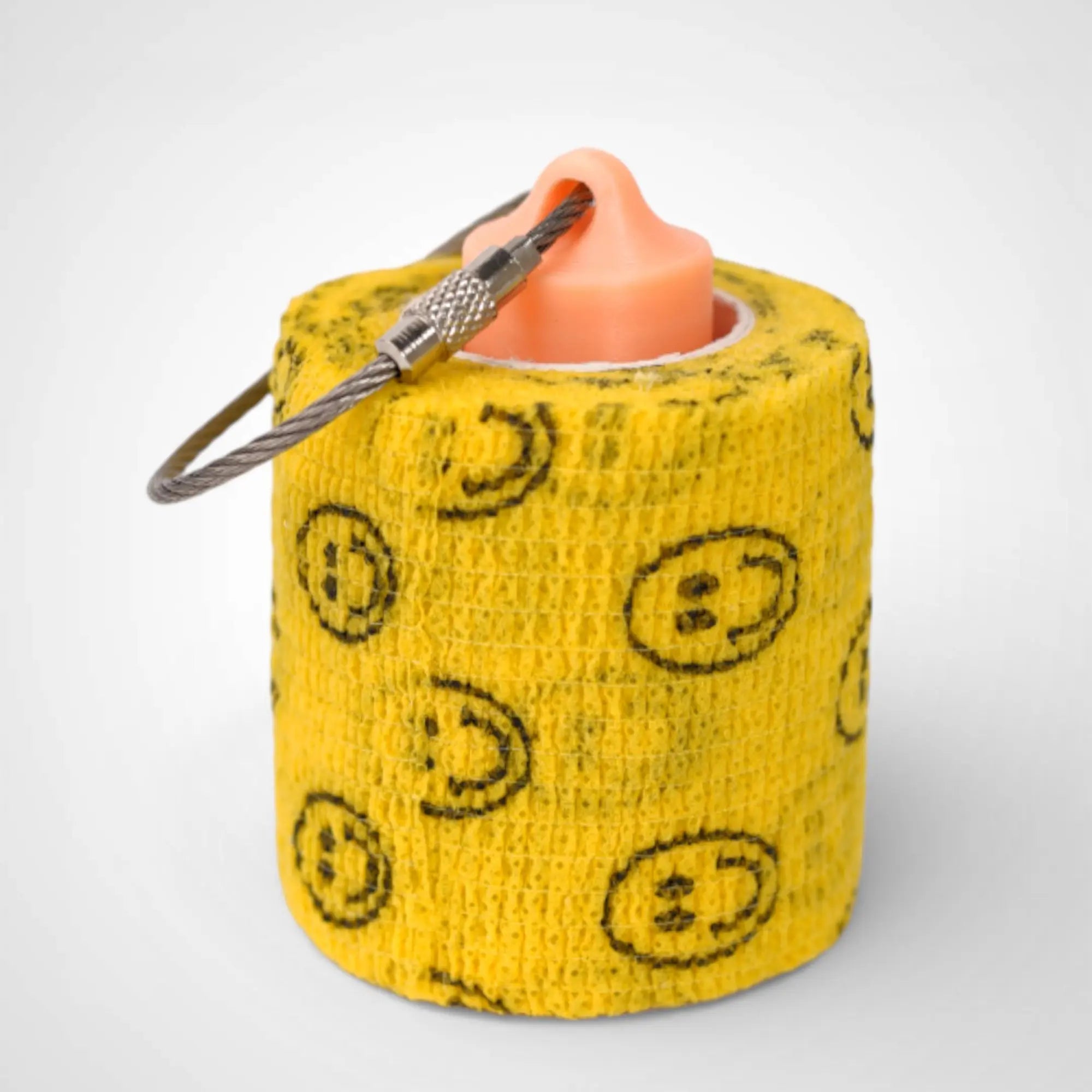 Orange/Glow Yellow 2-inch roll holder made with polylactic acid, created using additive manufacturing for holding tape and bandage rolls. With a steel cable keyring. Shown with tape on white background.