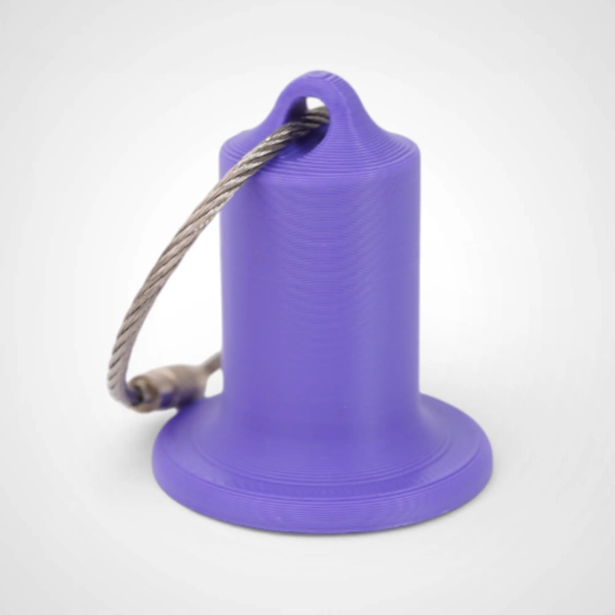 Purple 1-inch roll holder made with polylactic acid, created using additive manufacturing for holding tape and bandage rolls. With a steel cable keyring. Shown on white background.