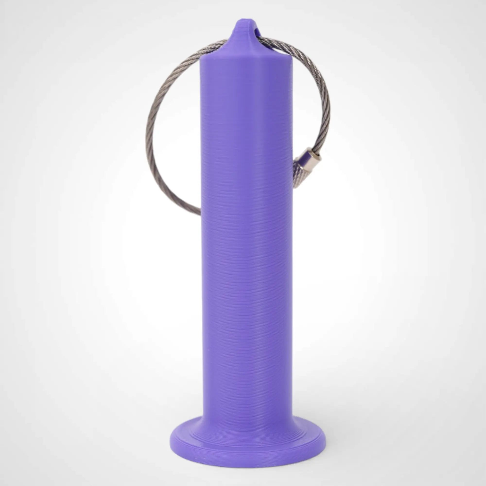 Purple 3-inch roll holder made with polylactic acid, created using additive manufacturing for holding tape and bandage rolls. With a steel cable keyring. Shown on white background.