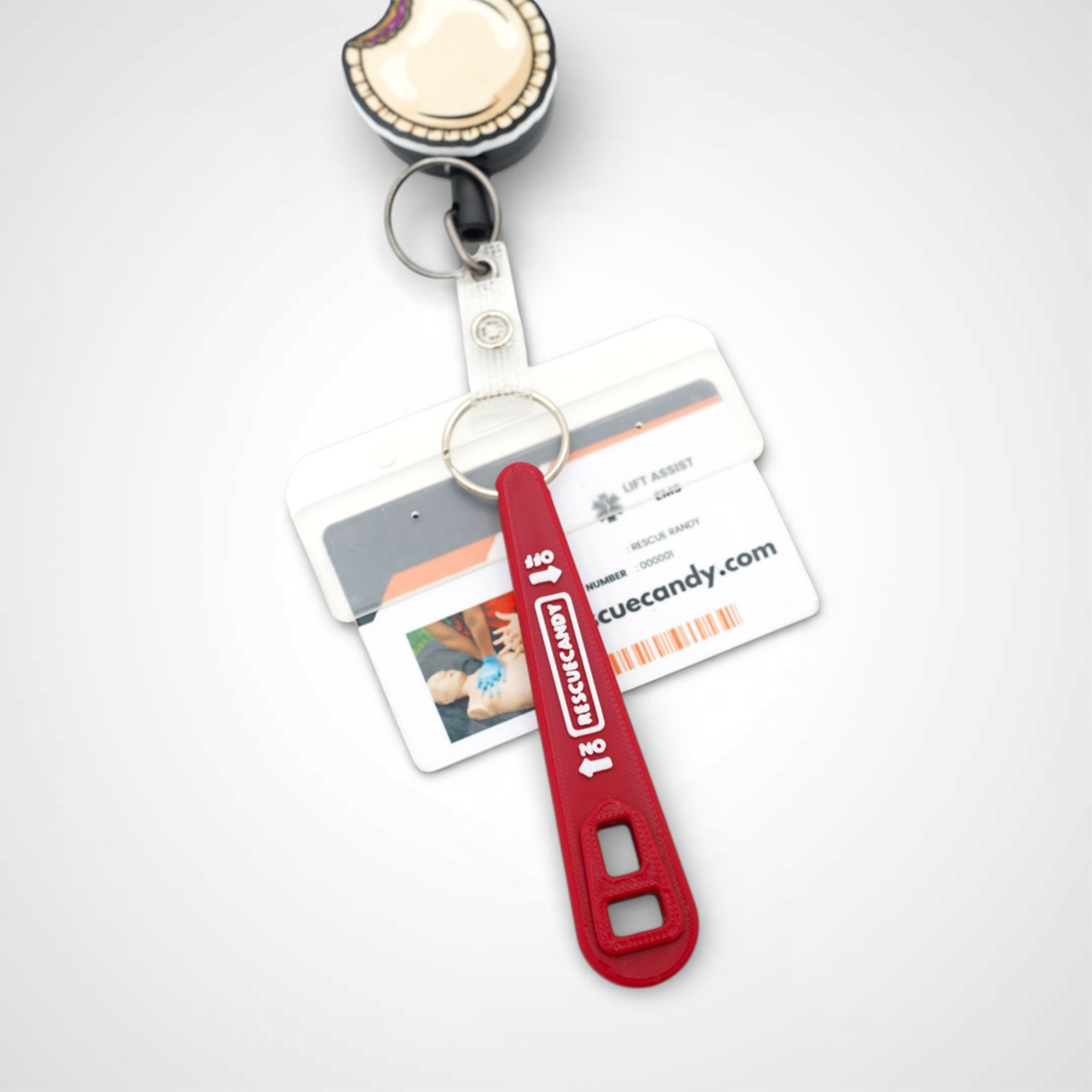 Full red Oxygen Wrench. Made to fit CGA-870 valves. Shown attached to badge on white background.