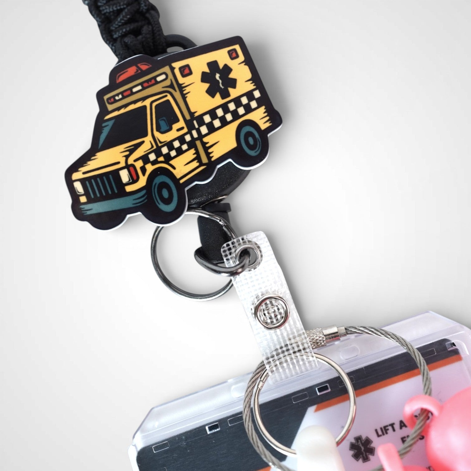 Taxi badge reel. On a carabiner with a steel retractable cable. Shown on a white background.