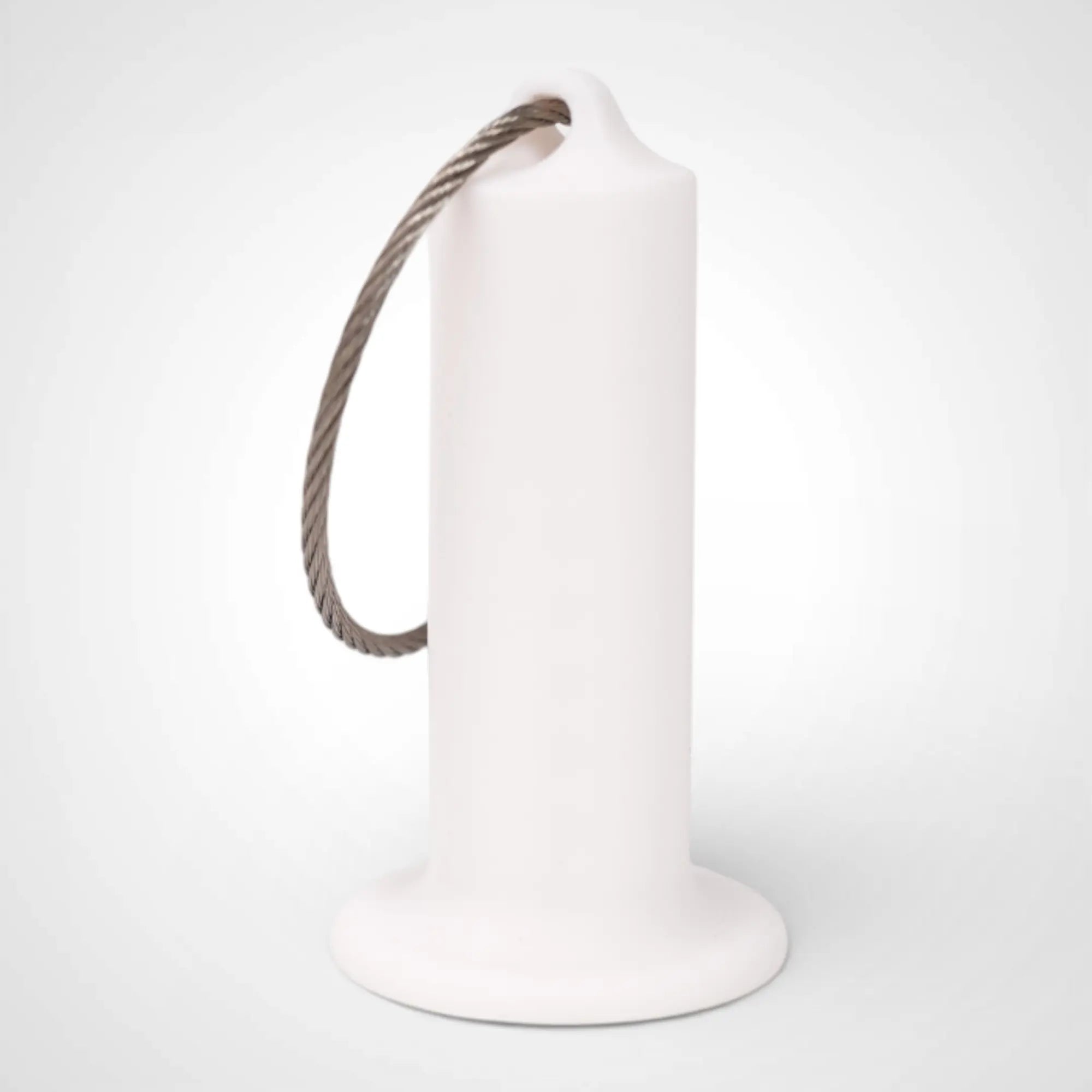 White 2-inch roll holder made with polylactic acid, created using additive manufacturing for holding tape and bandage rolls. With a steel cable keyring. Shown on white background.