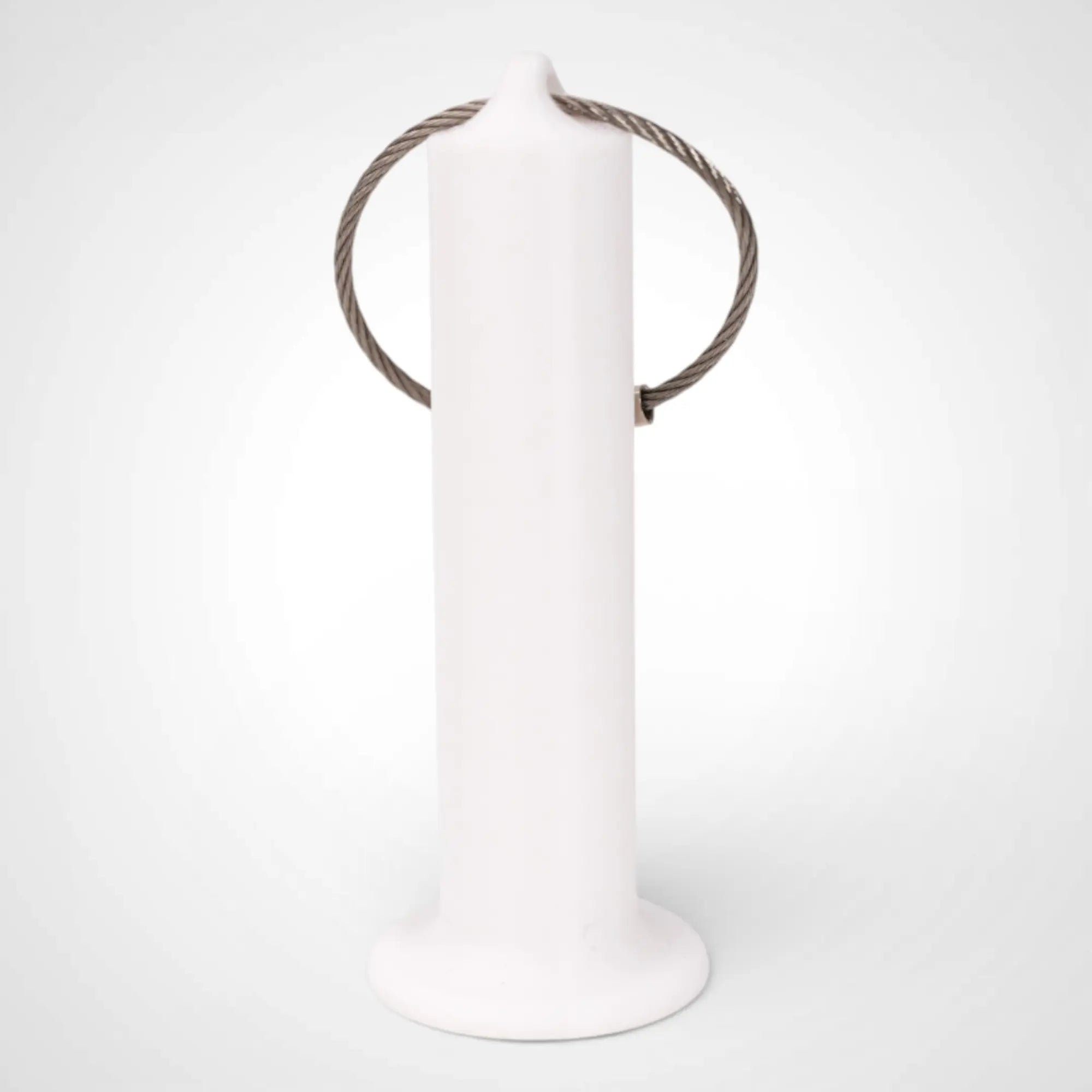 White 3-inch roll holder made with polylactic acid, created using additive manufacturing for holding tape and bandage rolls. With a steel cable keyring. Shown on white background.