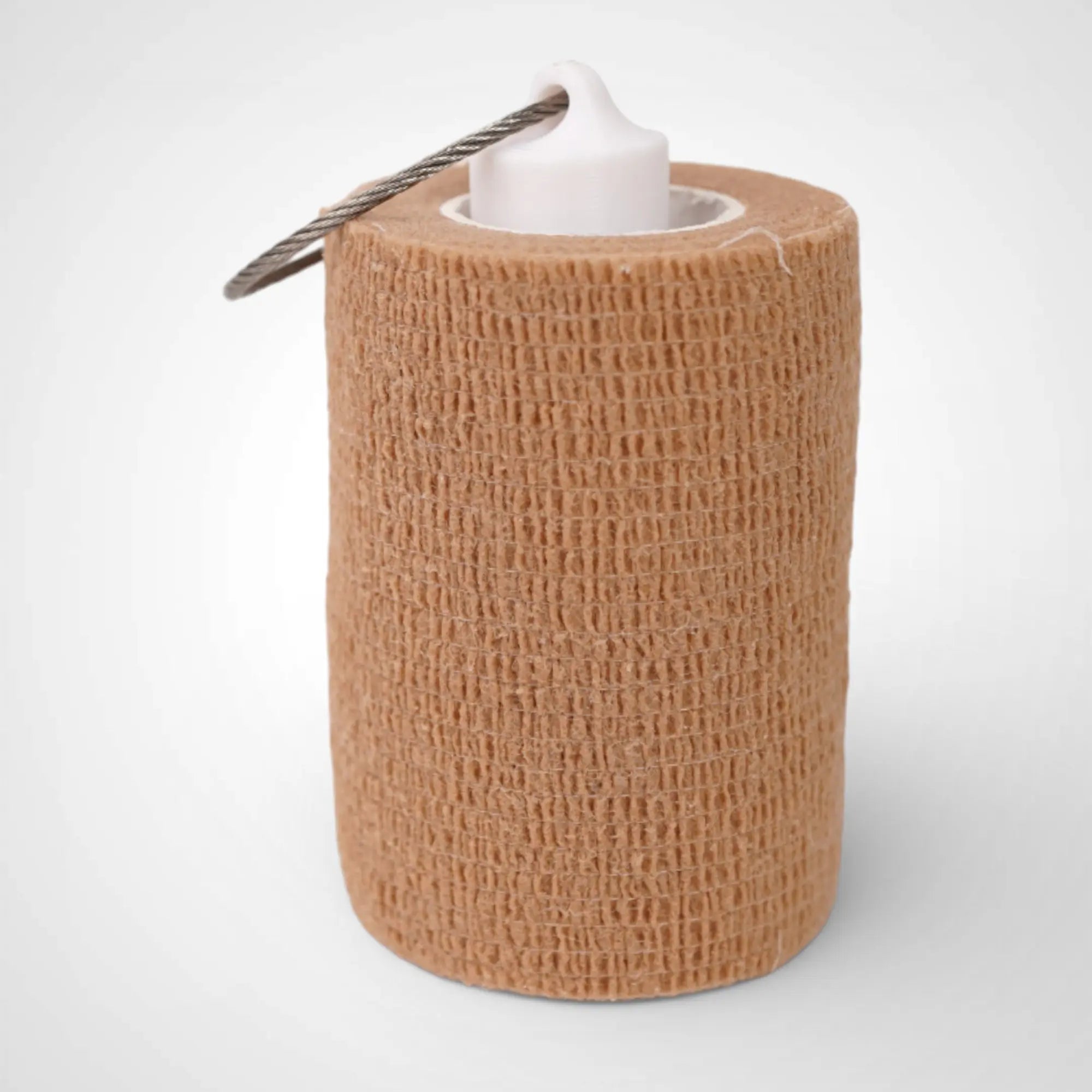 White 3-inch roll holder made with polylactic acid, created using additive manufacturing for holding tape and bandage rolls. With a steel cable keyring. Shown with tape on white background.