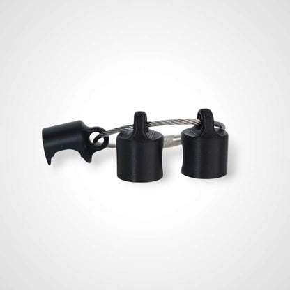 Black polylactic acid created using additive manufacturing B-Braun cap clip on steel cable keyring. Shown on white background.